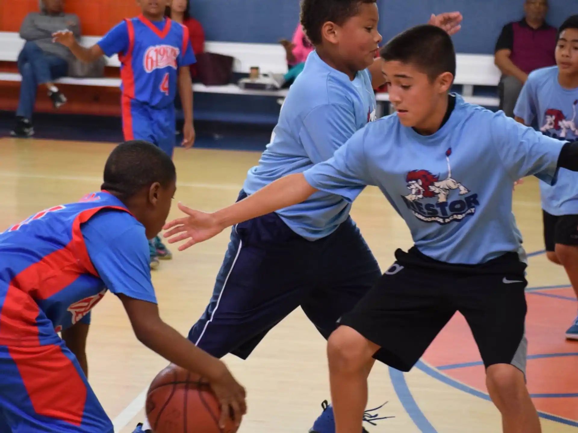 a group of boys playing basketball