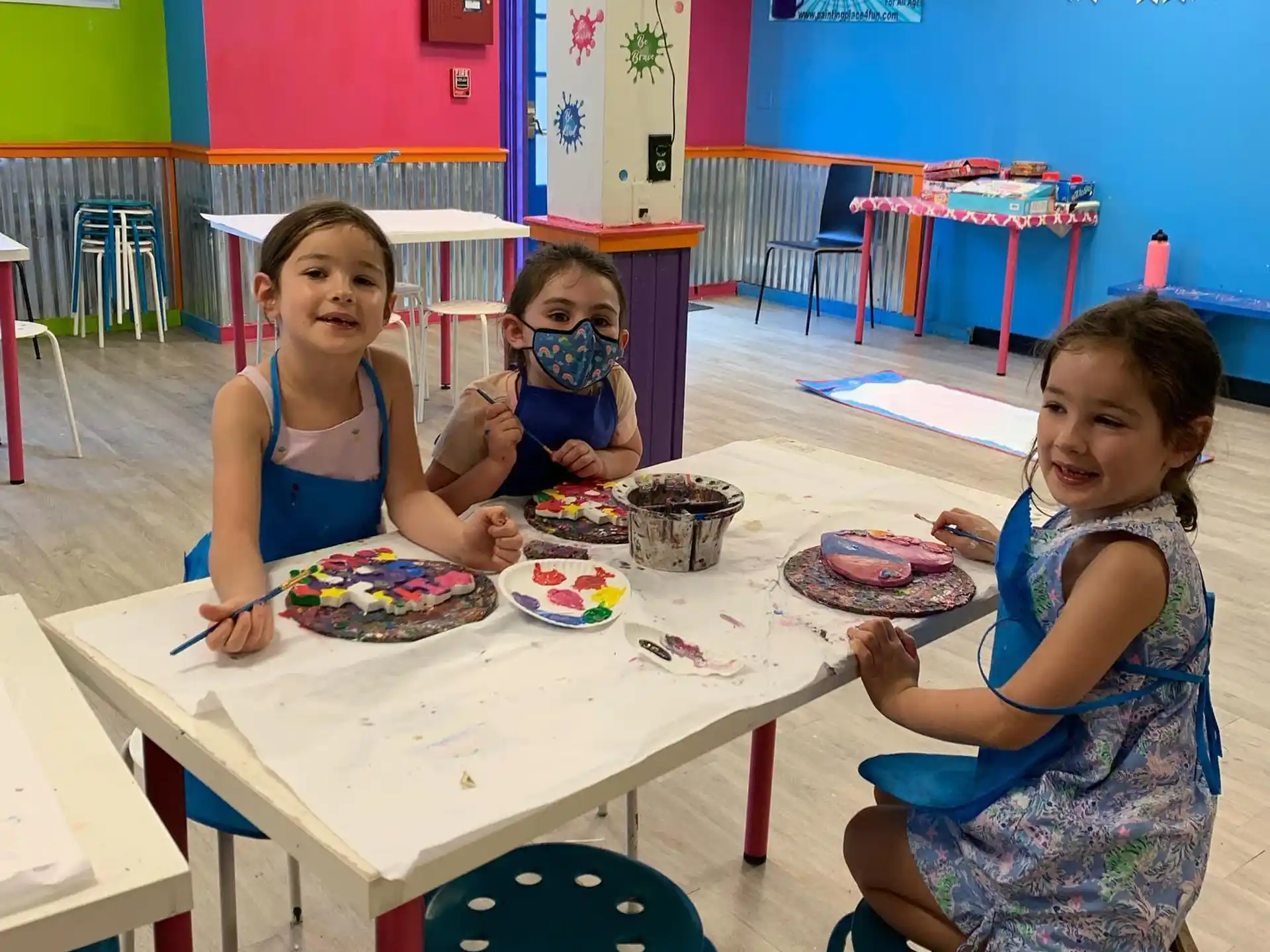 a group of girls eating at a table