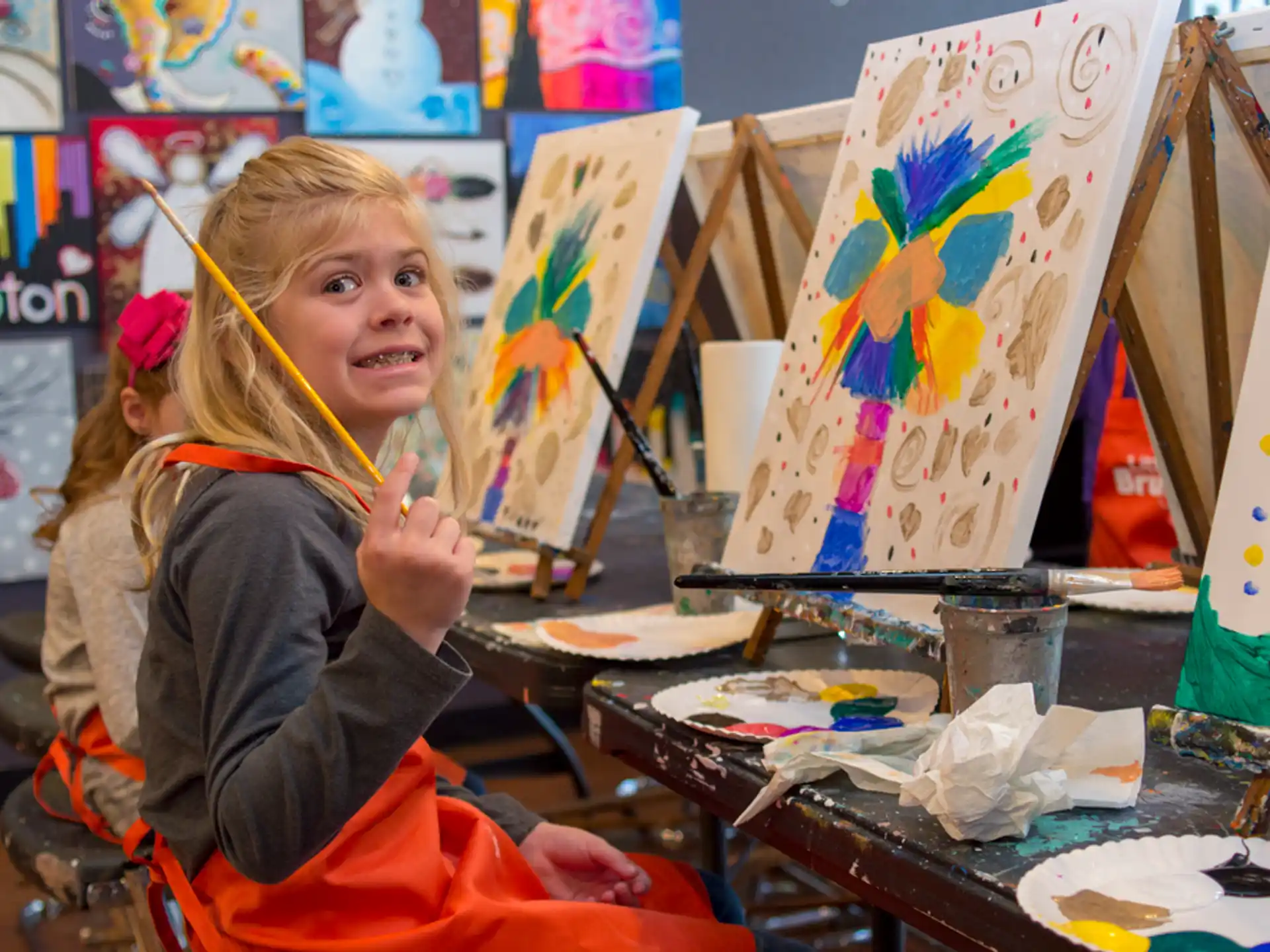 a girl painting on a table