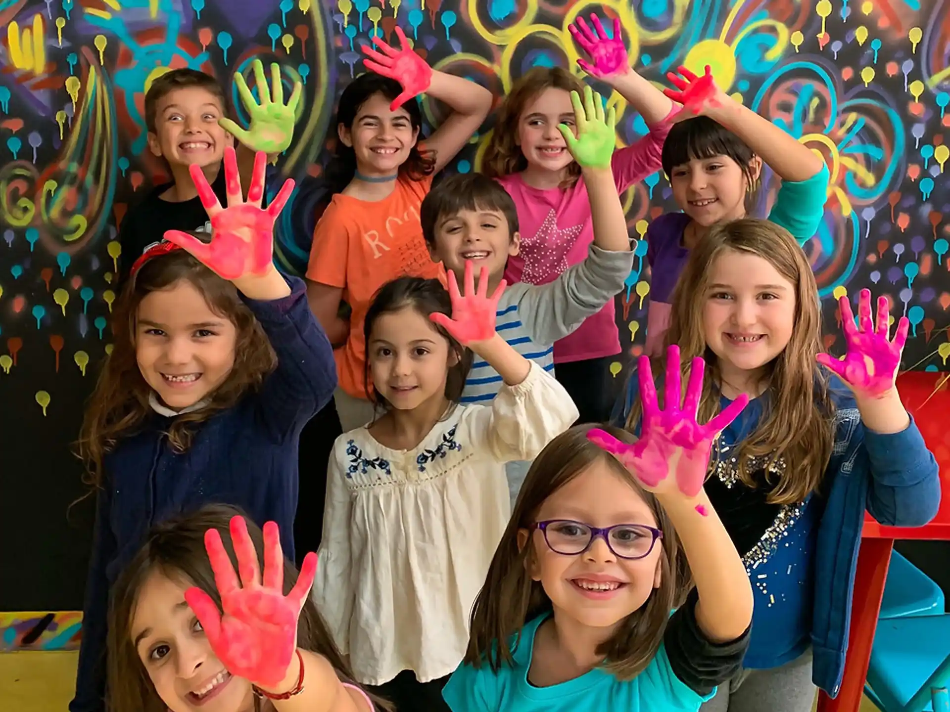 a group of children wearing party hats