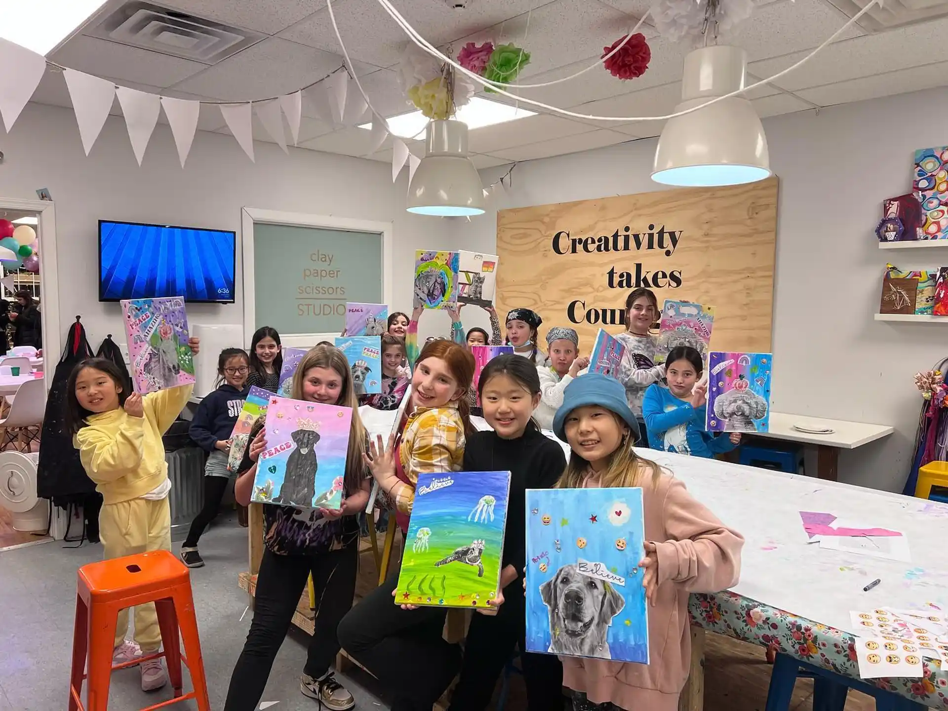 a group of children holding posters