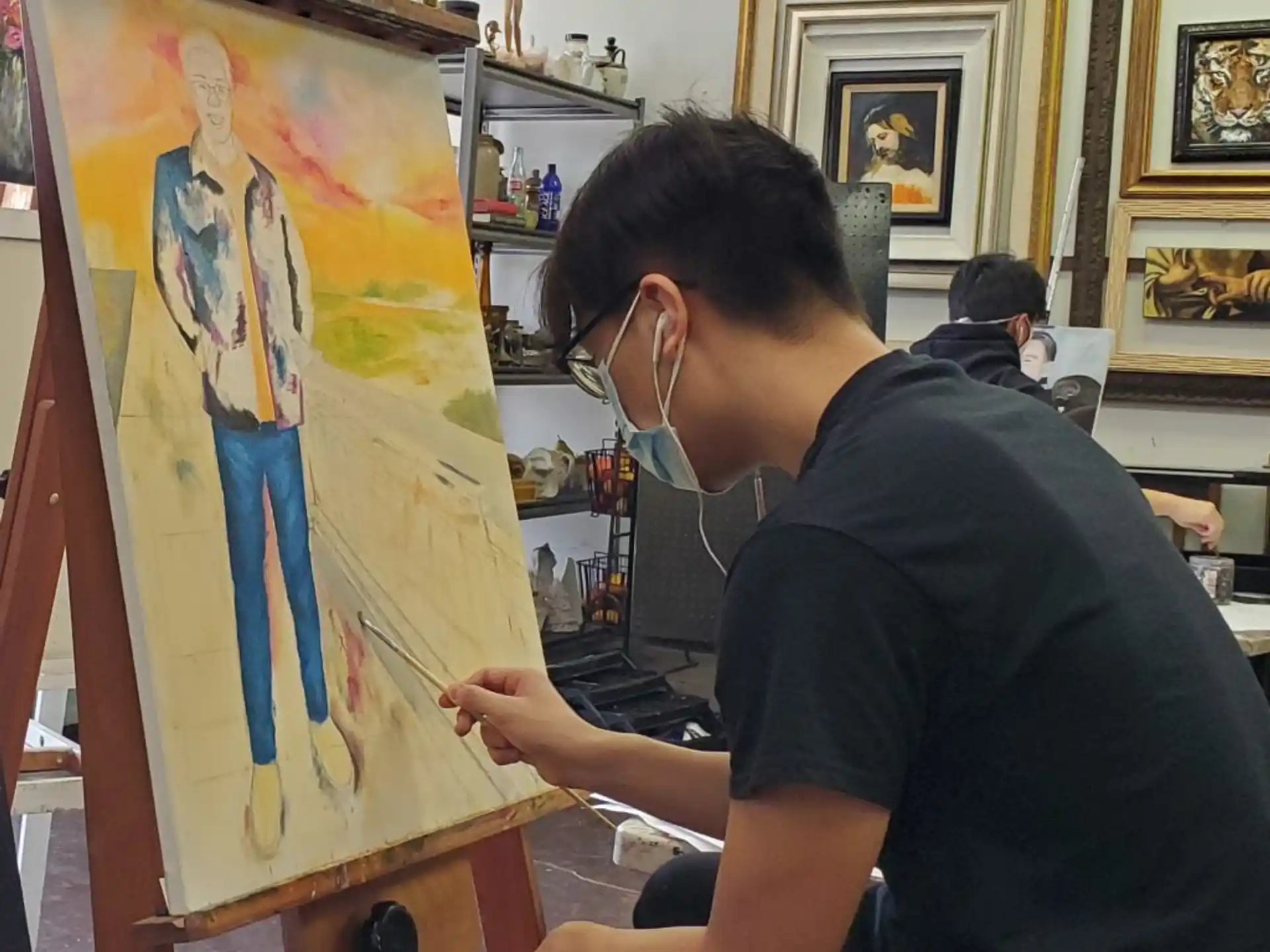 a man painting a picture