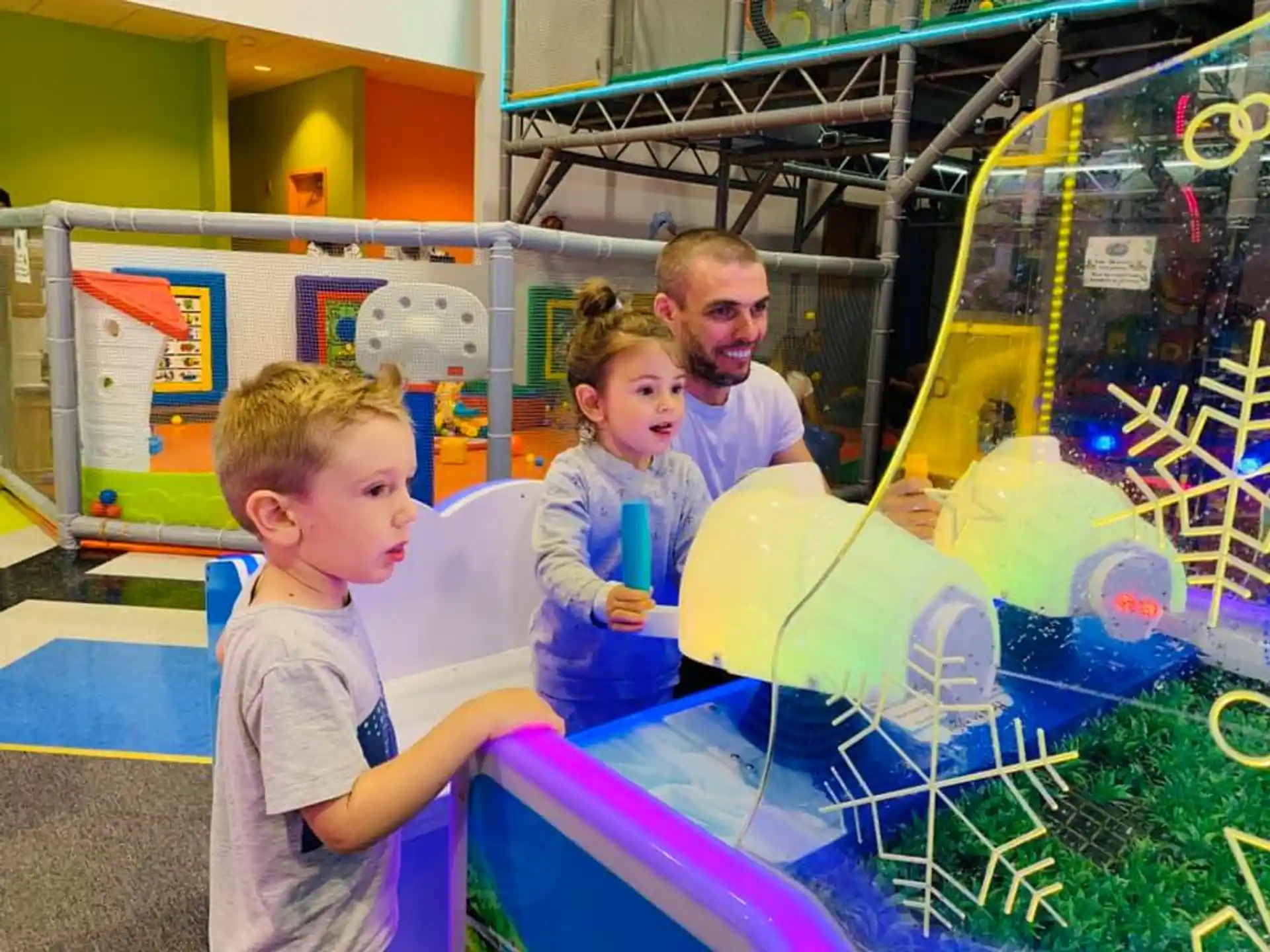 a group of kids playing in a play area