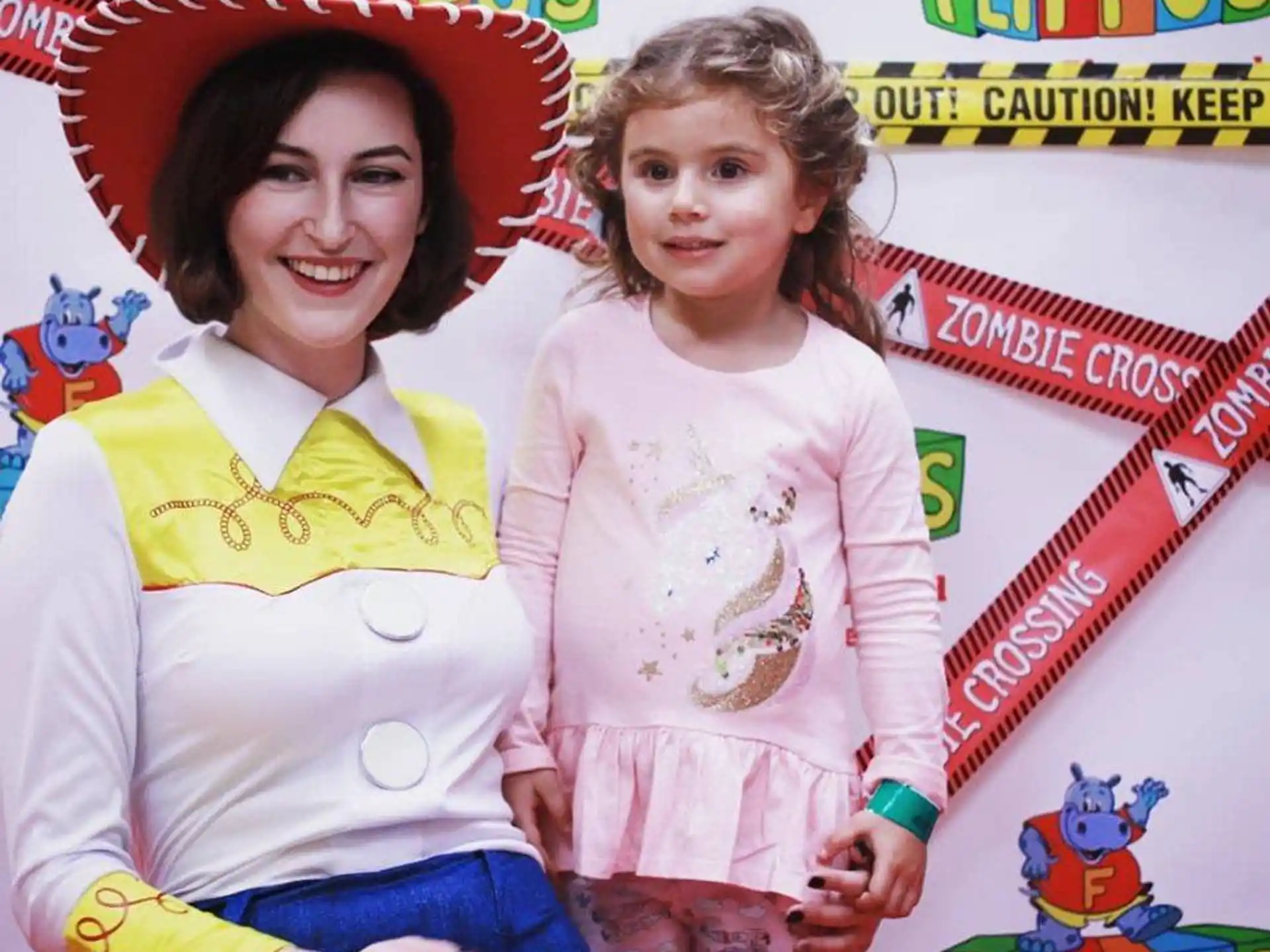a person and a child posing for the camera