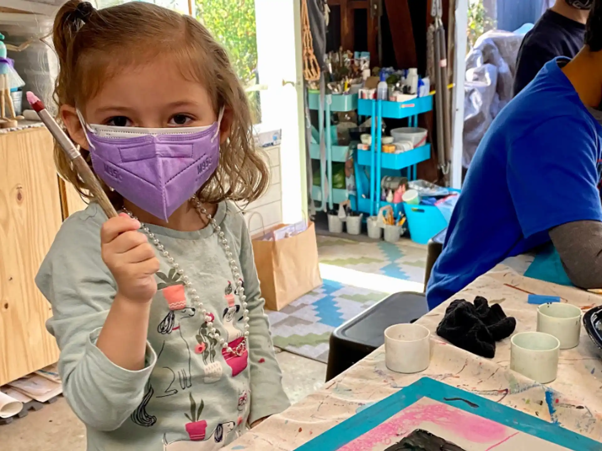 a young girl painting
