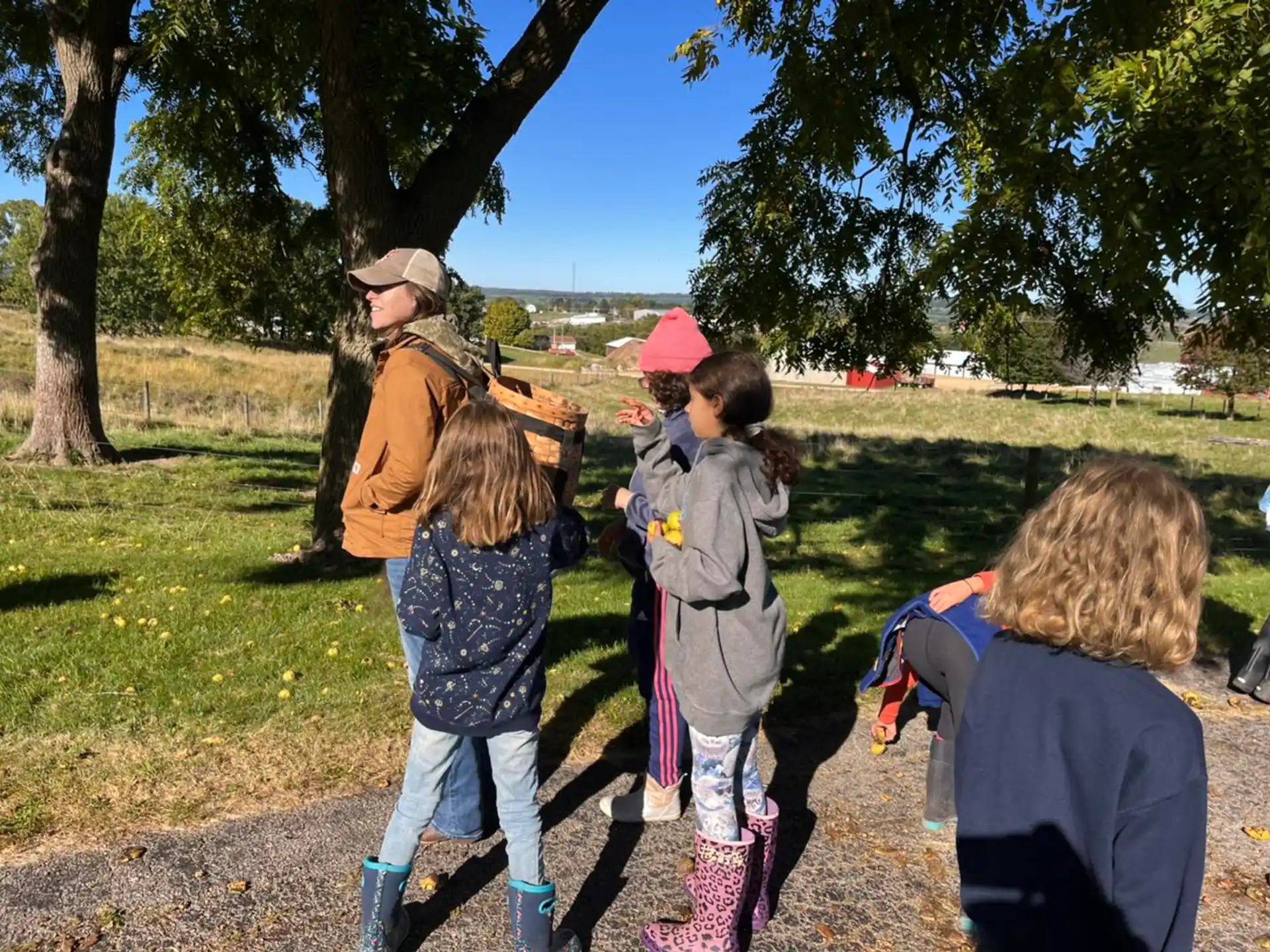 a group of children walking in a park