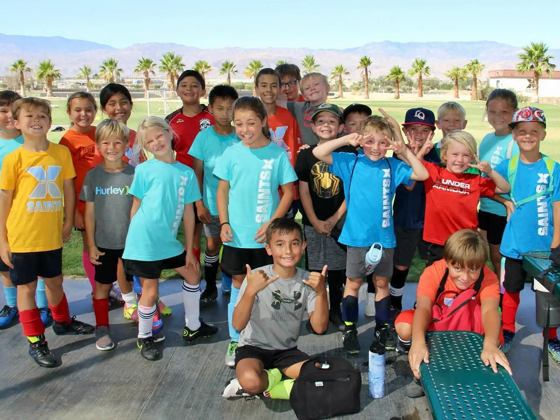 a group of kids posing for a photo