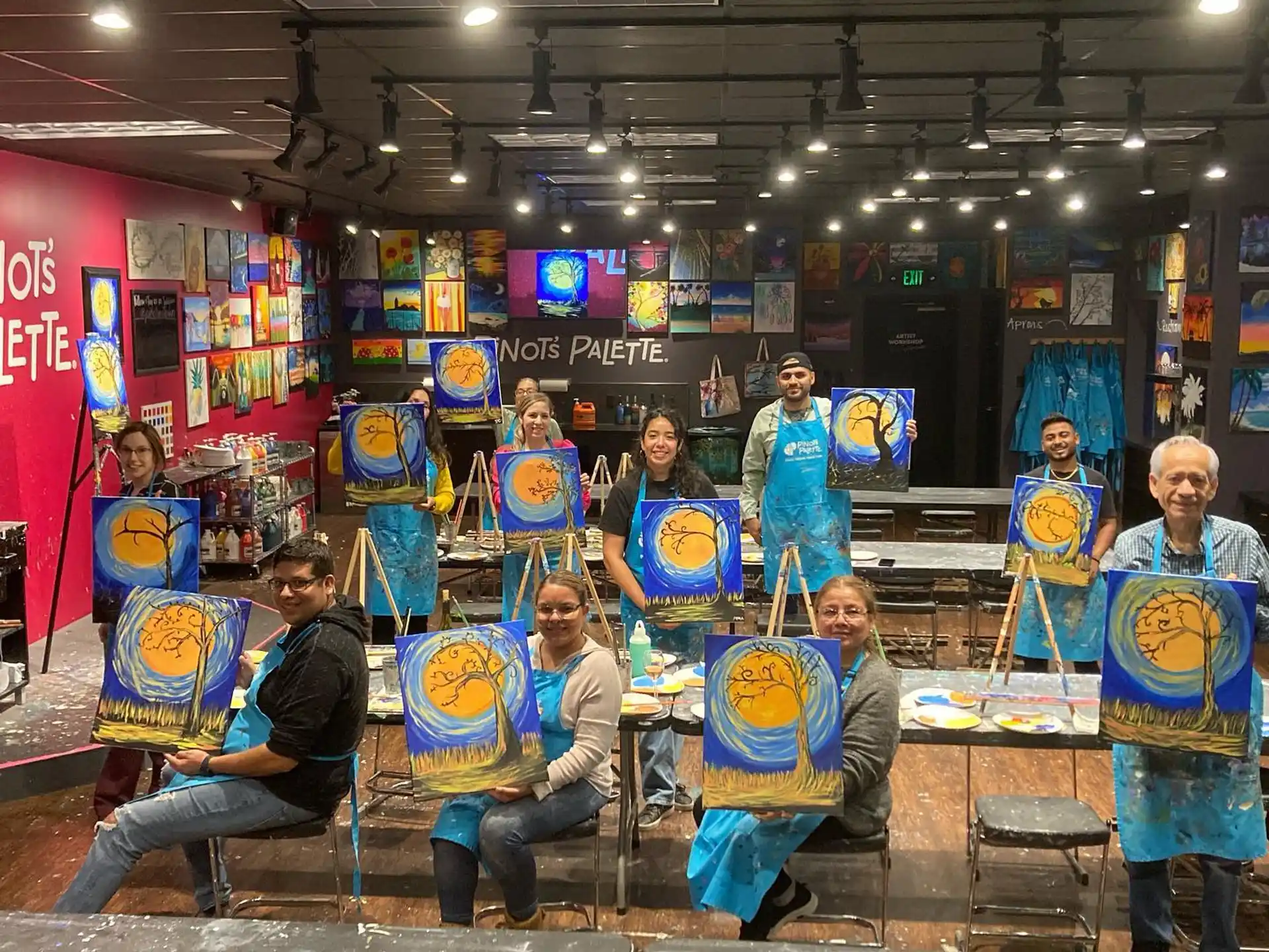 a group of people holding colorful shields