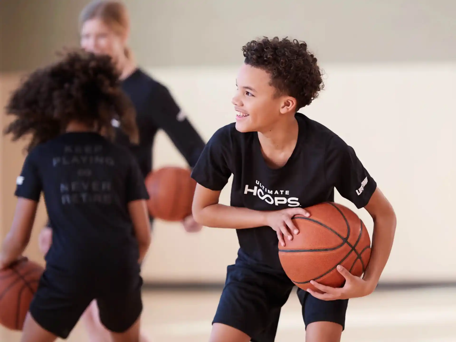 a boy holding a basketball