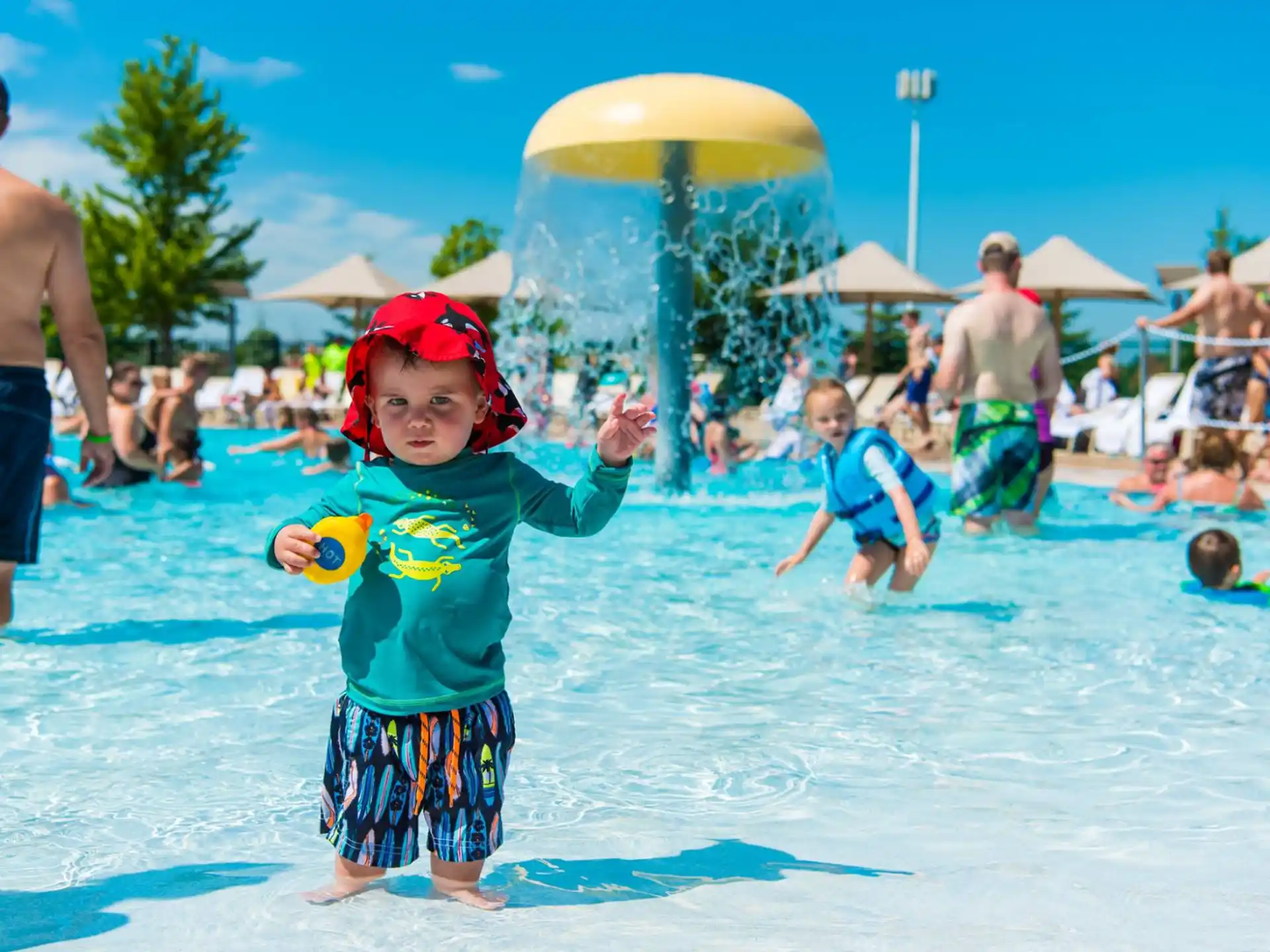 a kid playing in the water