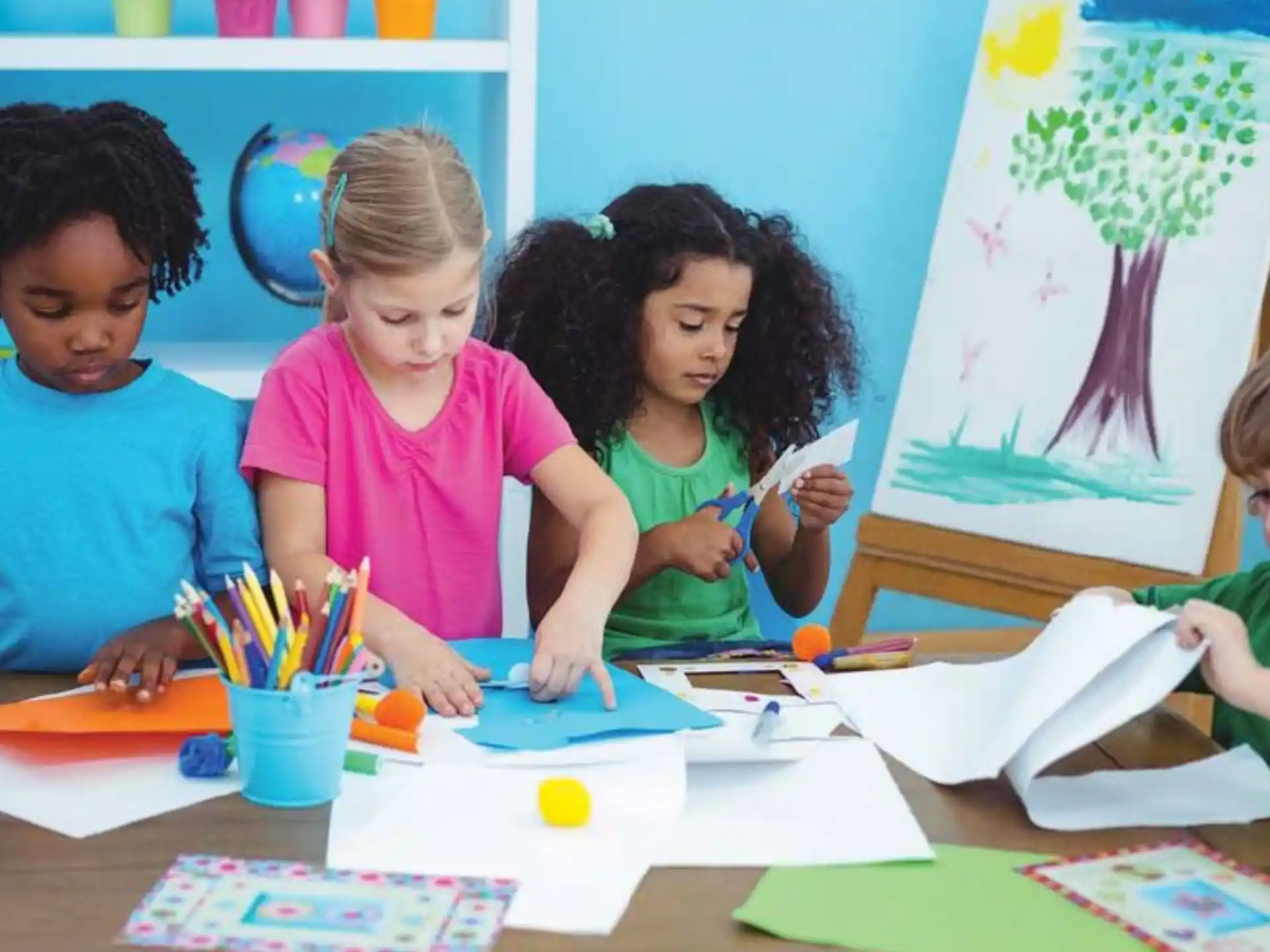 a group of children sitting at a table