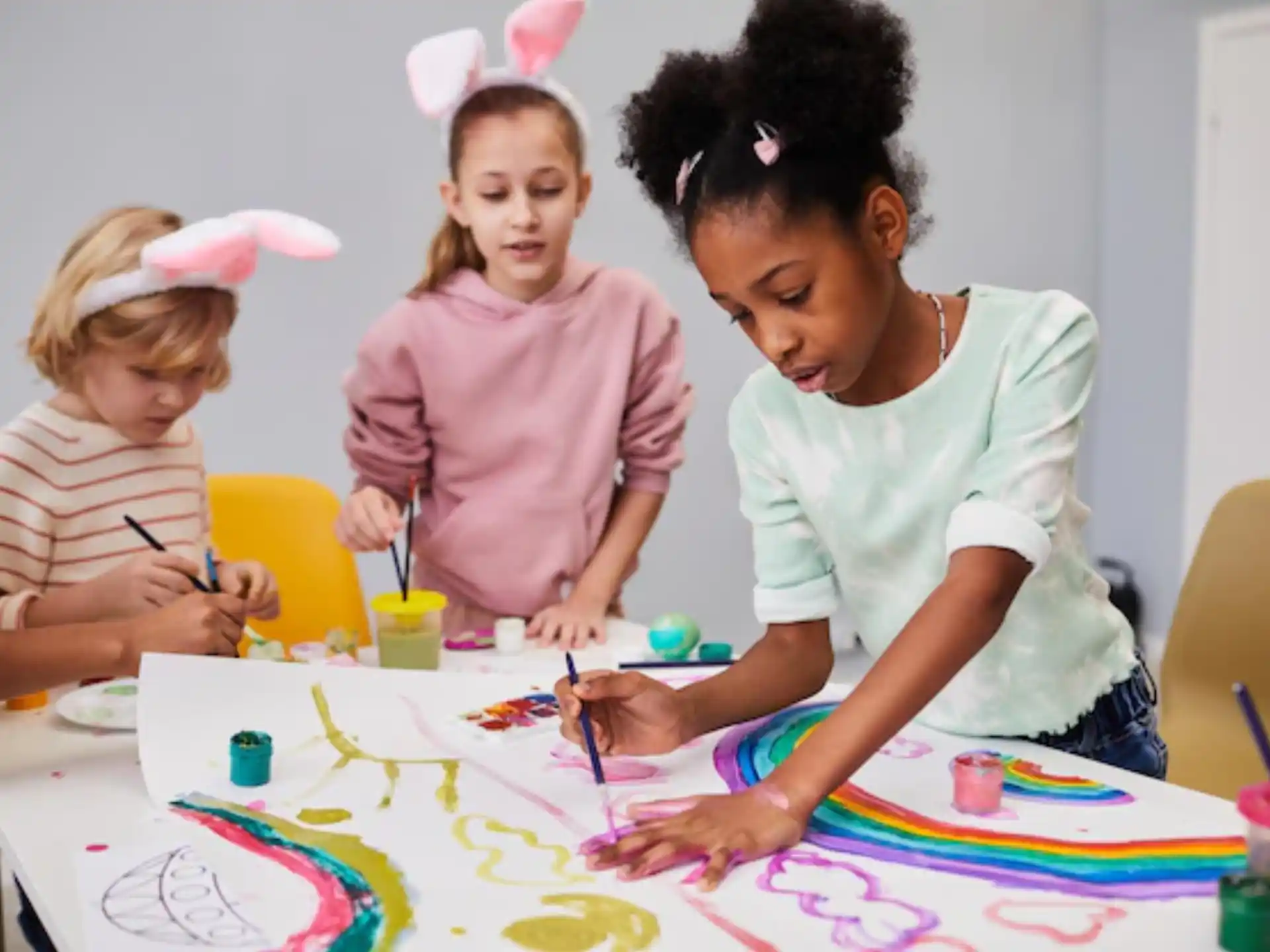 a person and children painting