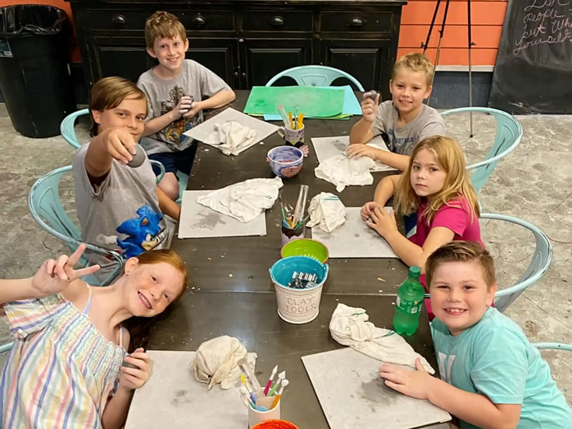 a group of children sitting at a table