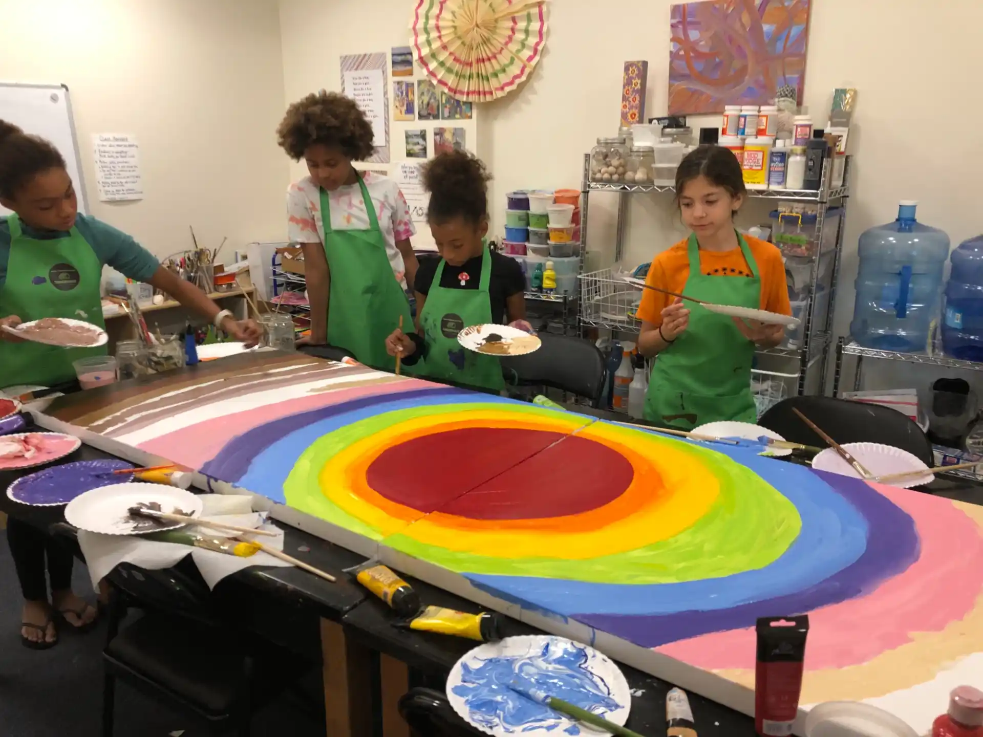 a group of children painting