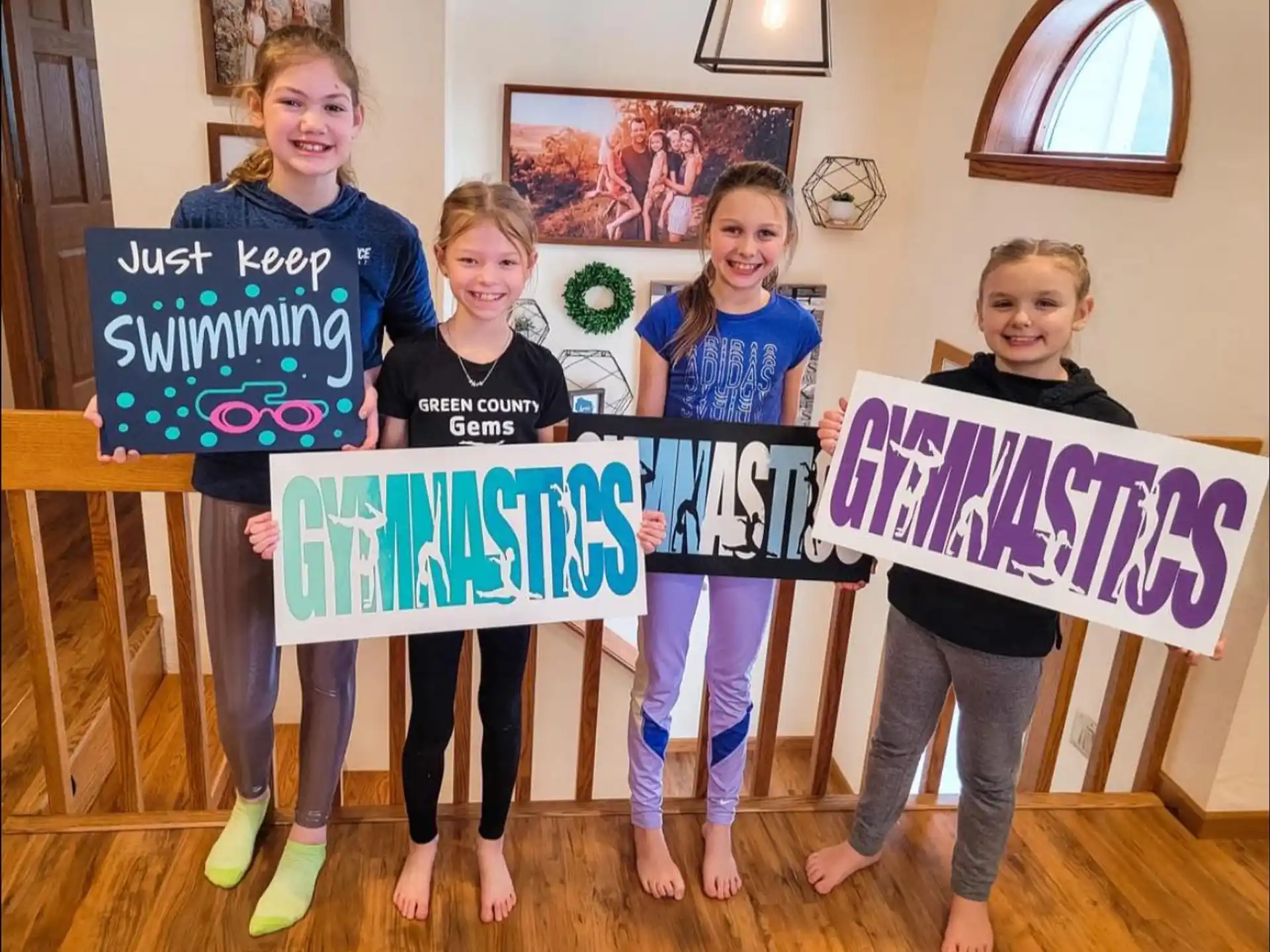 a group of girls holding signs