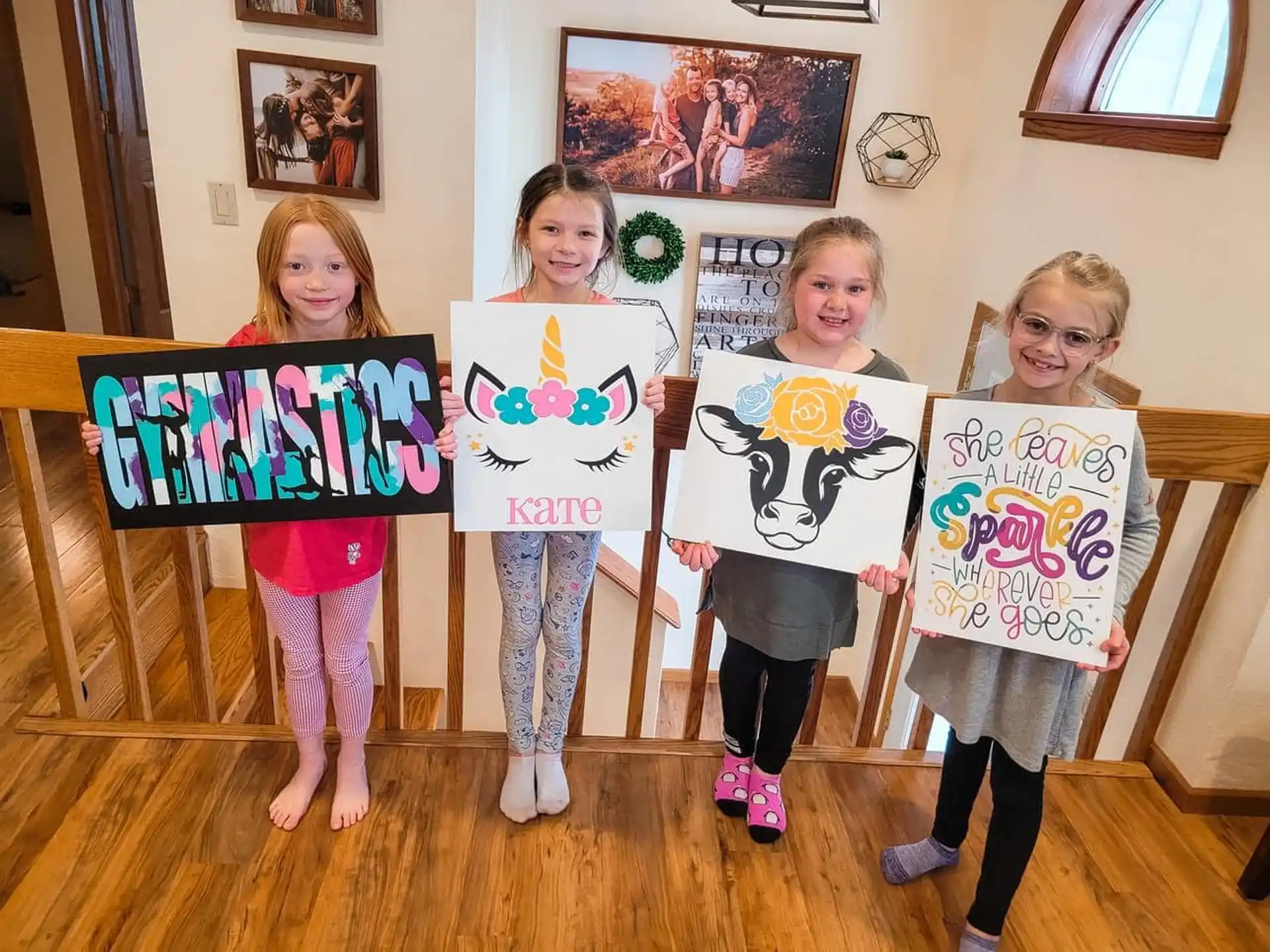 a group of girls holding signs