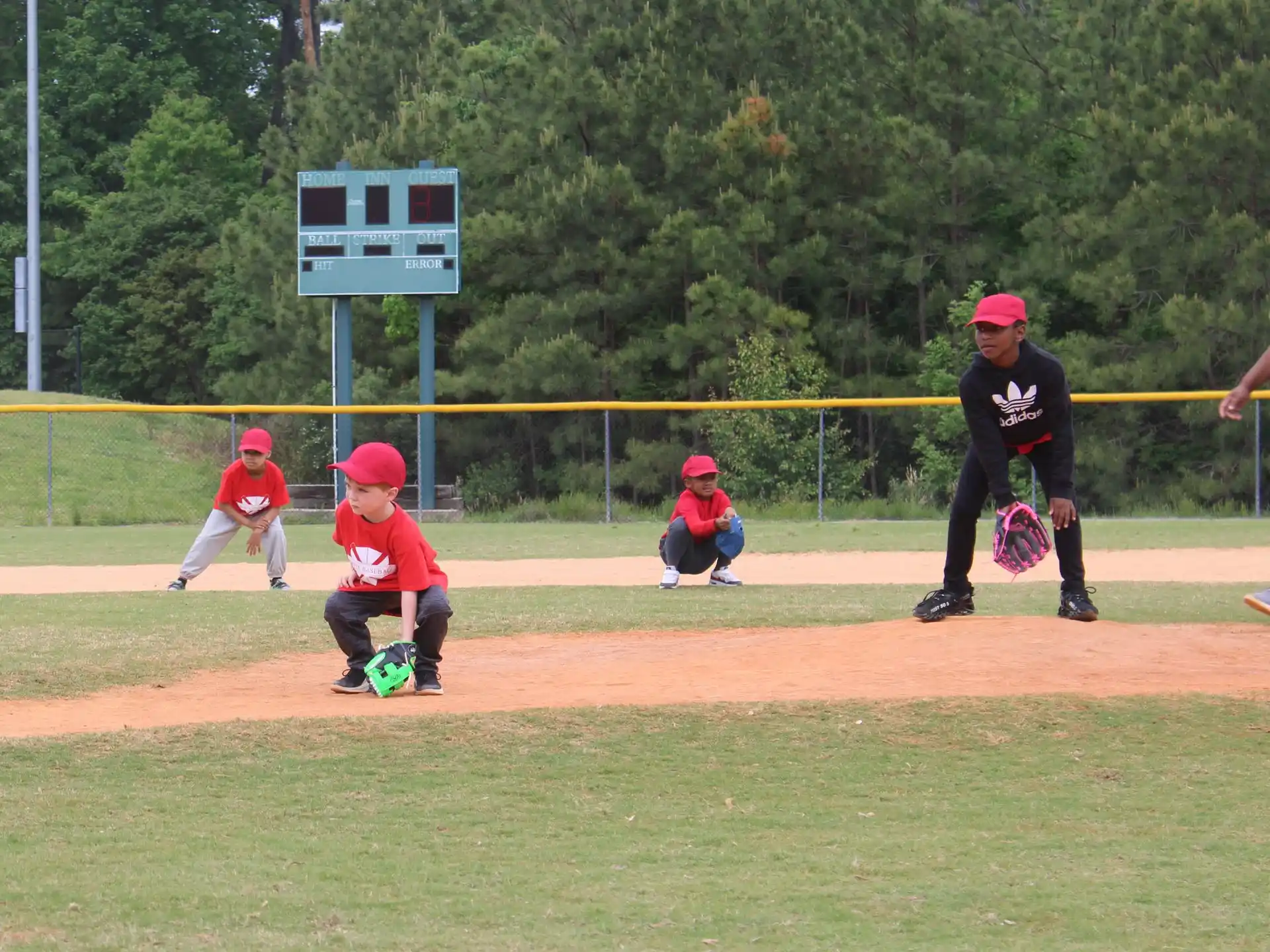 kids playing baseball on a field