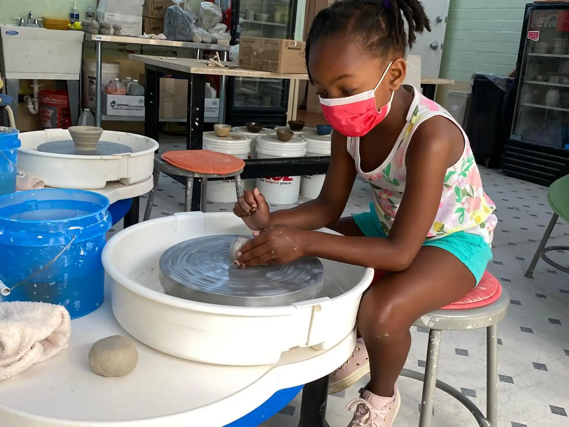 a young girl wearing a mask