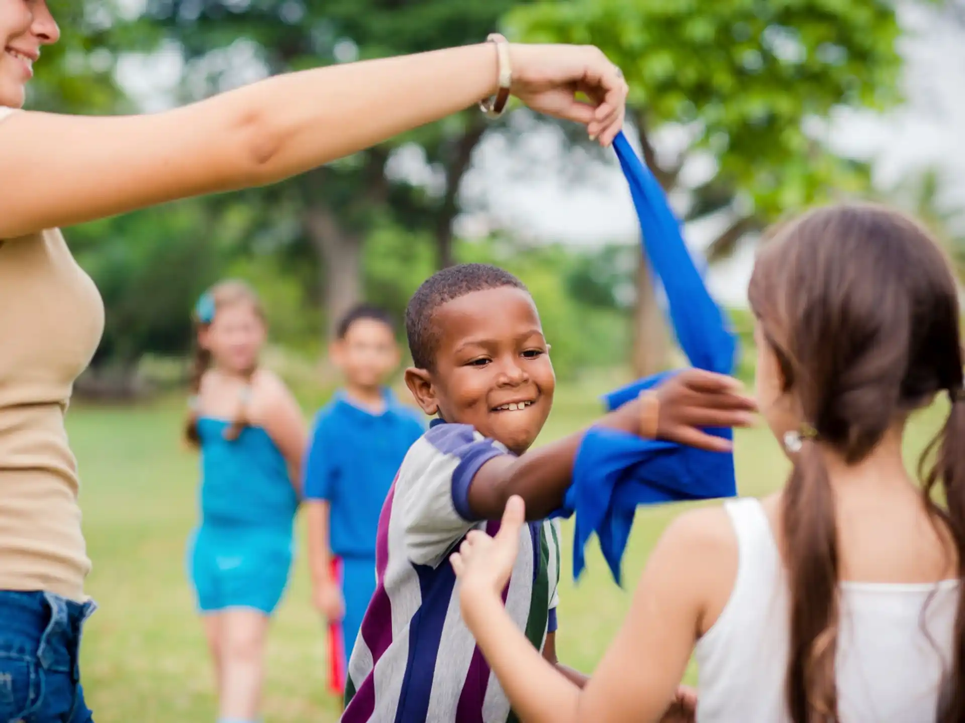 a group of children holding up their hands