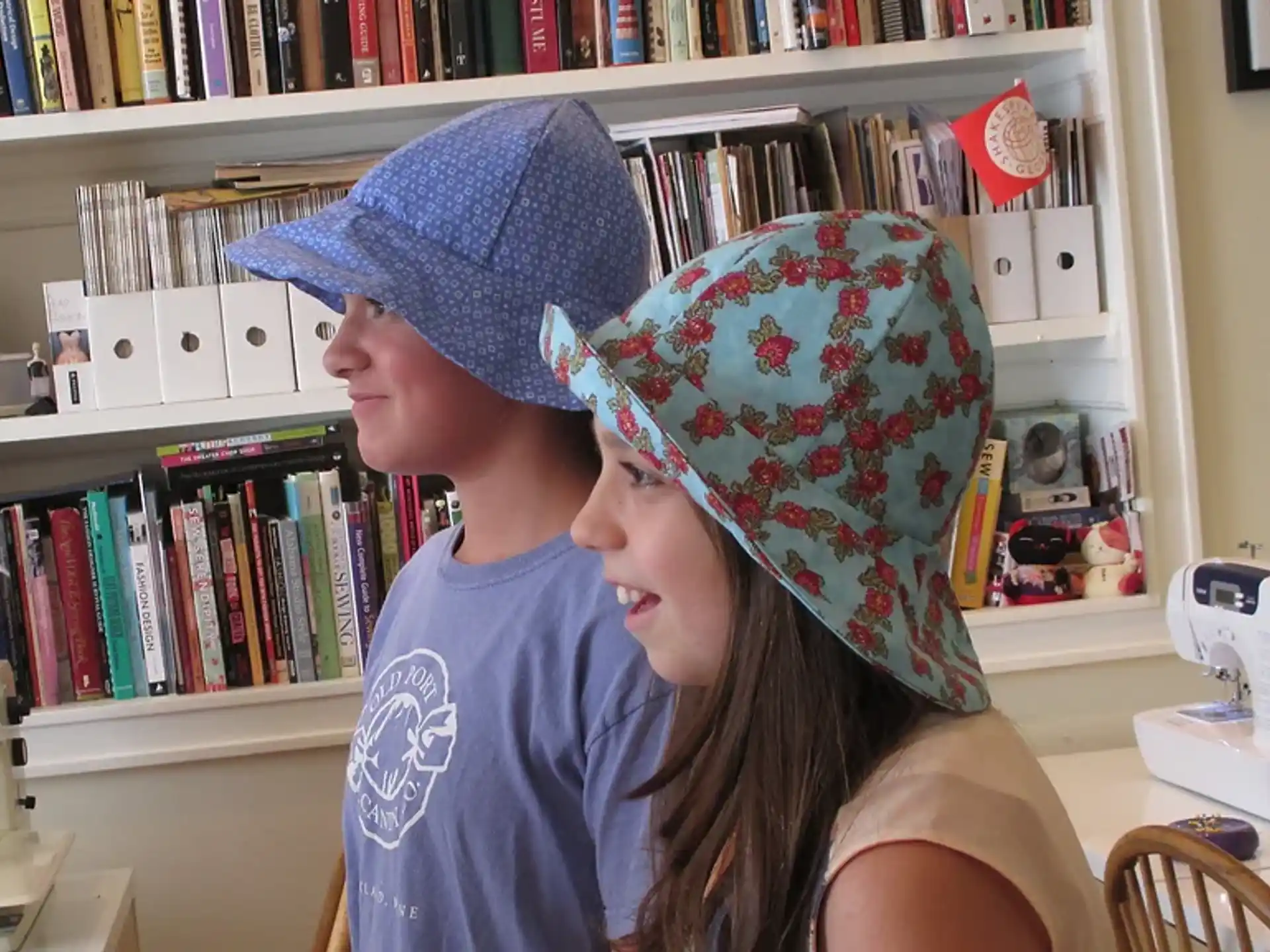 a boy and girl wearing hats