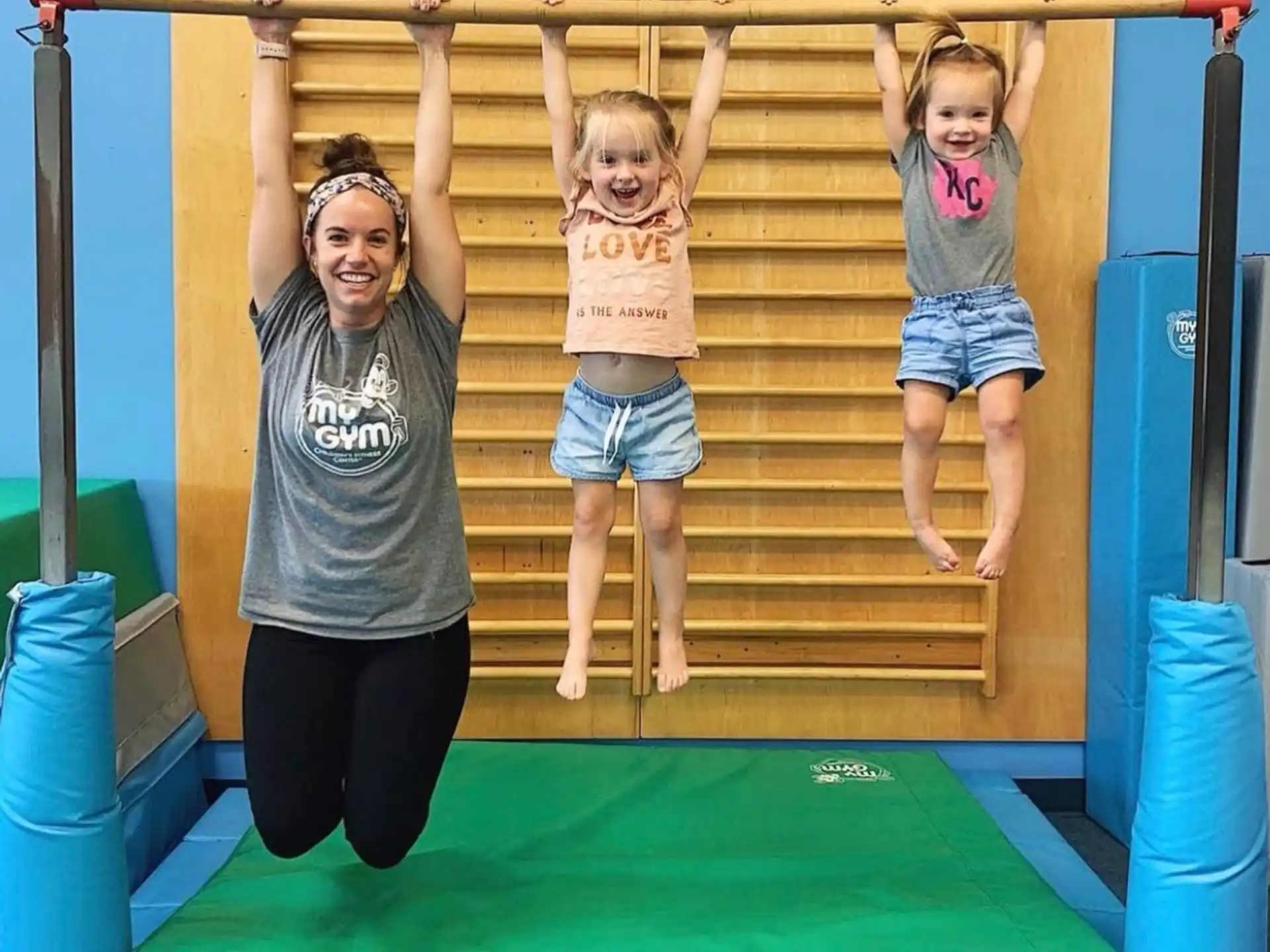 a person and a child on a playground slide