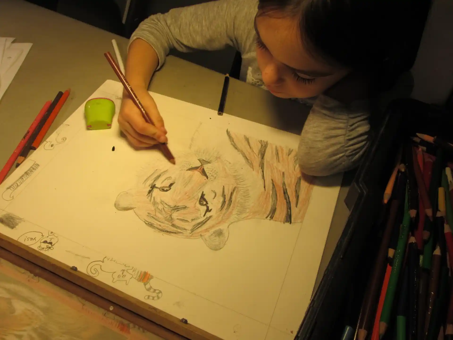 a child drawing on a paper