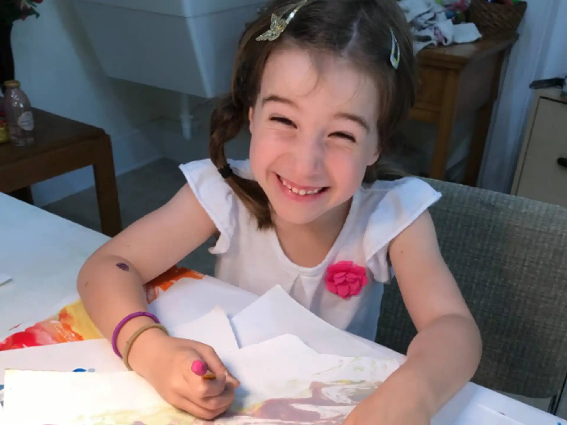 a girl sitting at a table