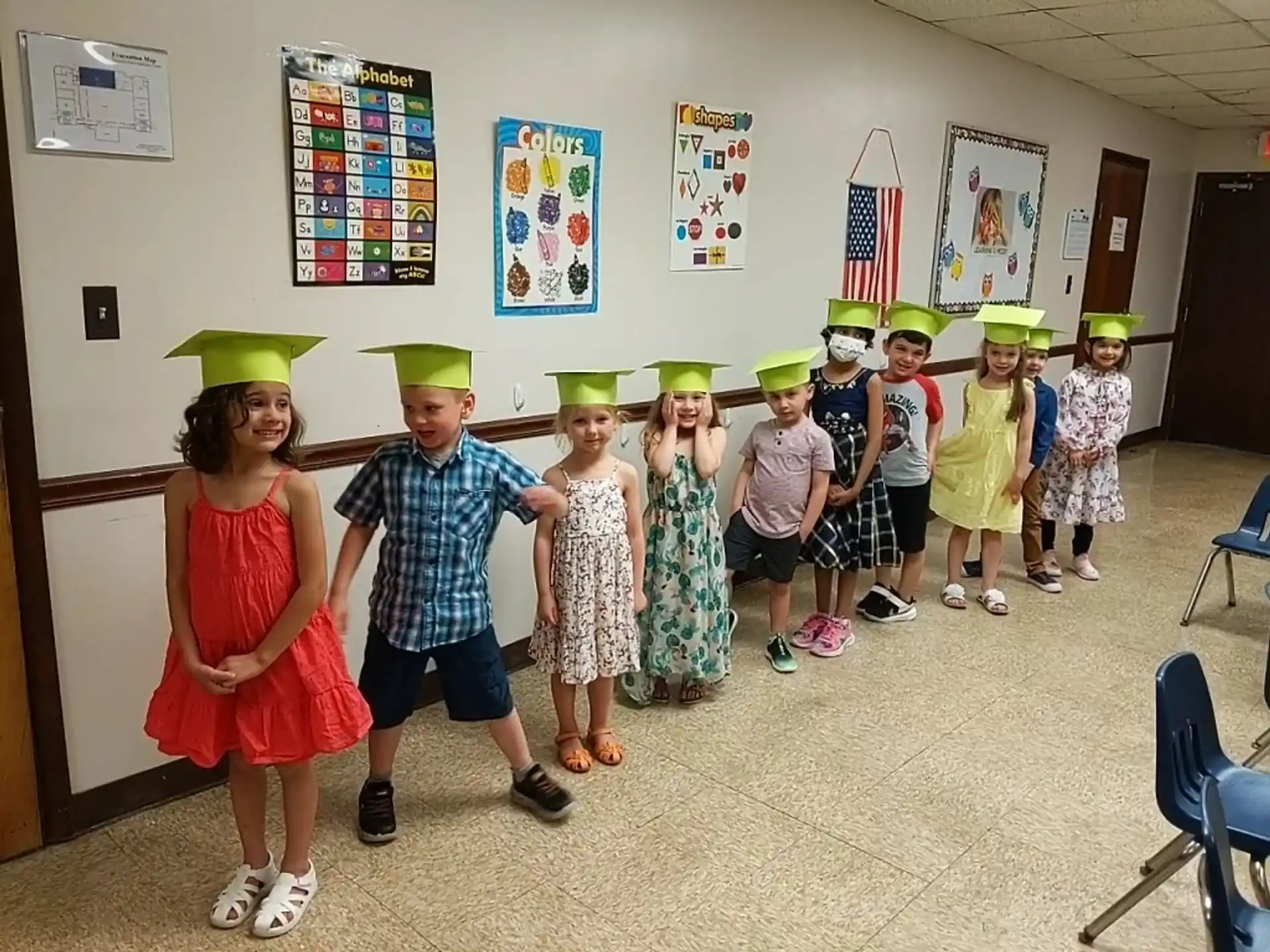 a group of children wearing paper hats