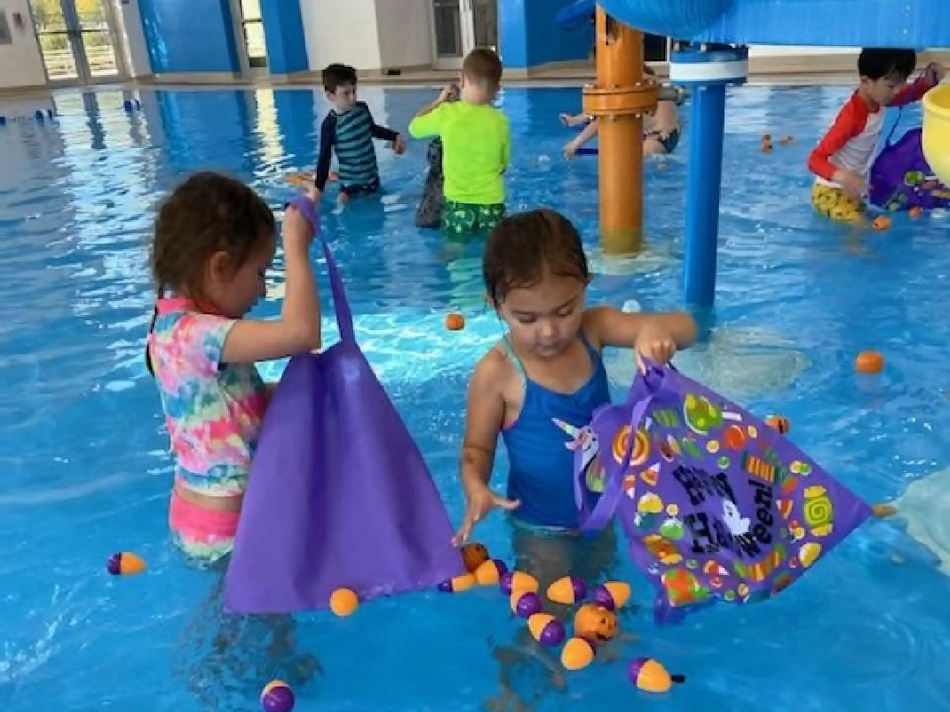 children playing in a pool