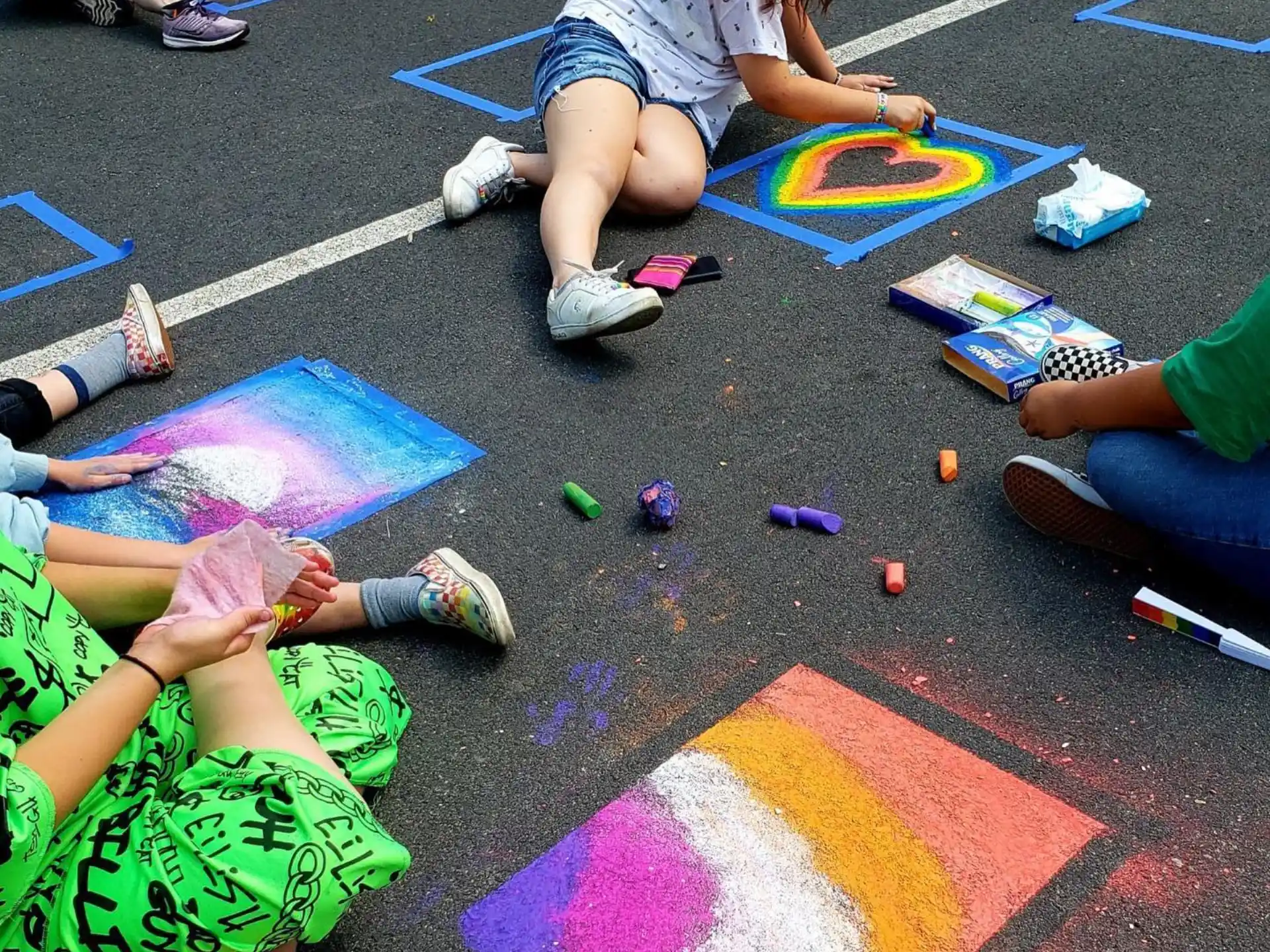 a group of people painting on the ground