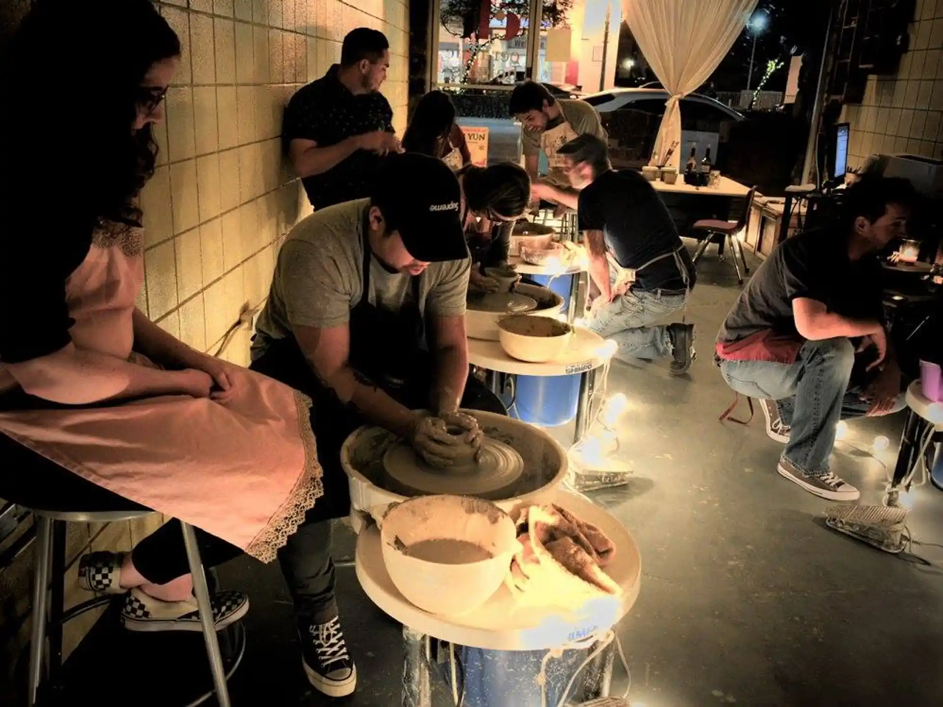 a group of people cooking in a kitchen