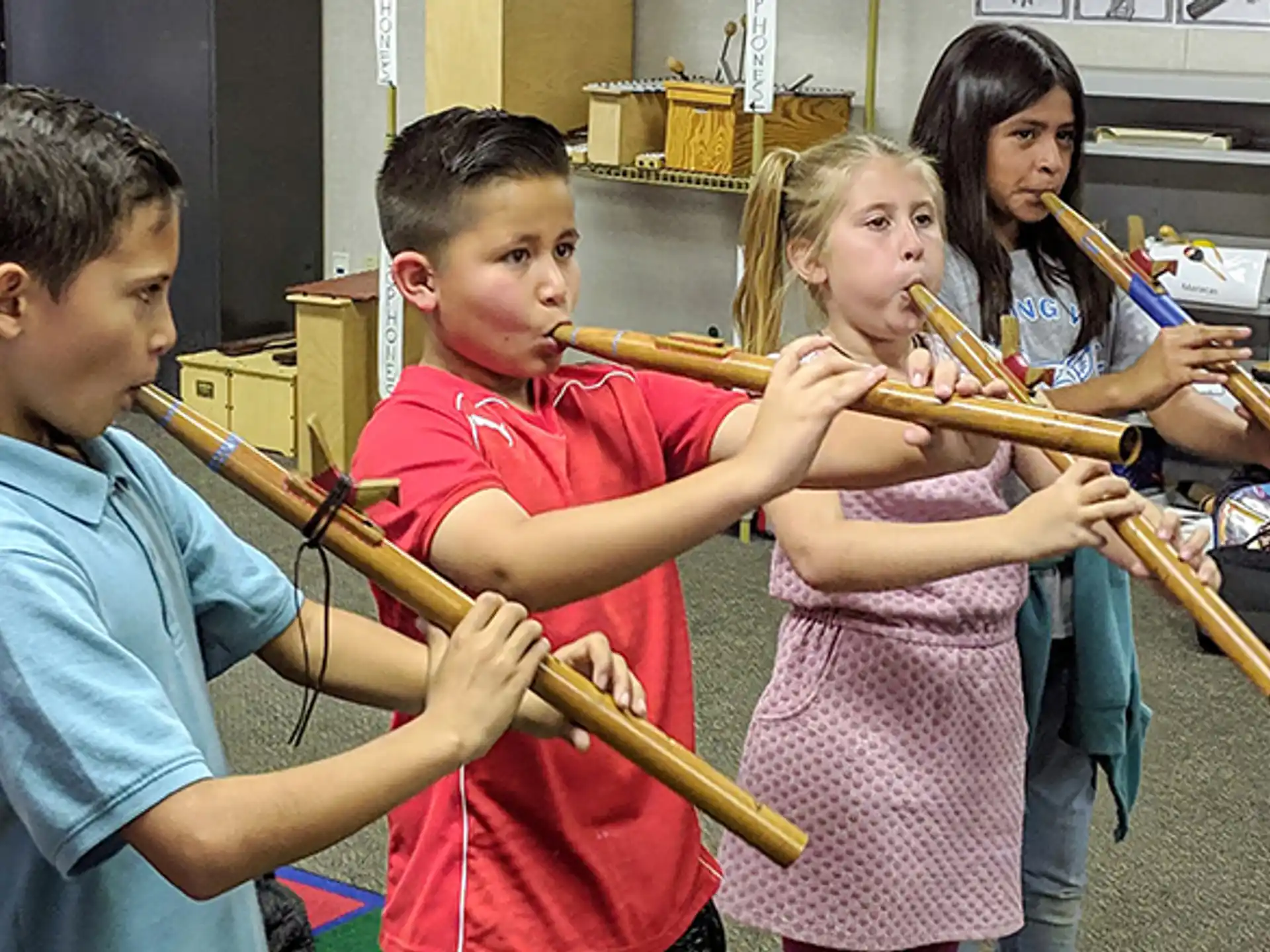 a group of kids playing instruments