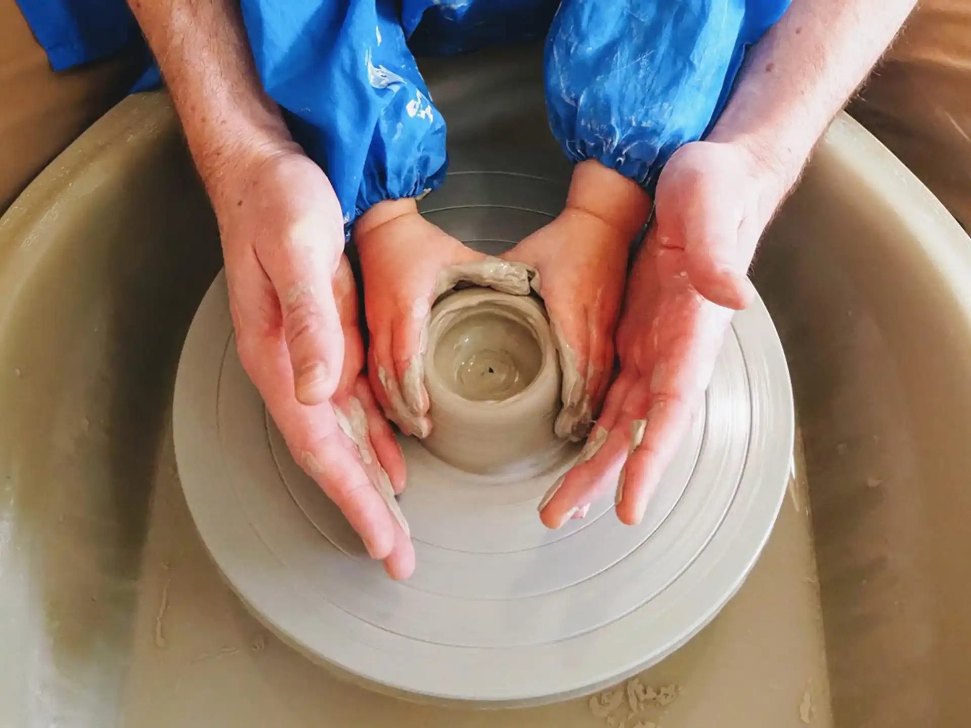 a person washing a sink
