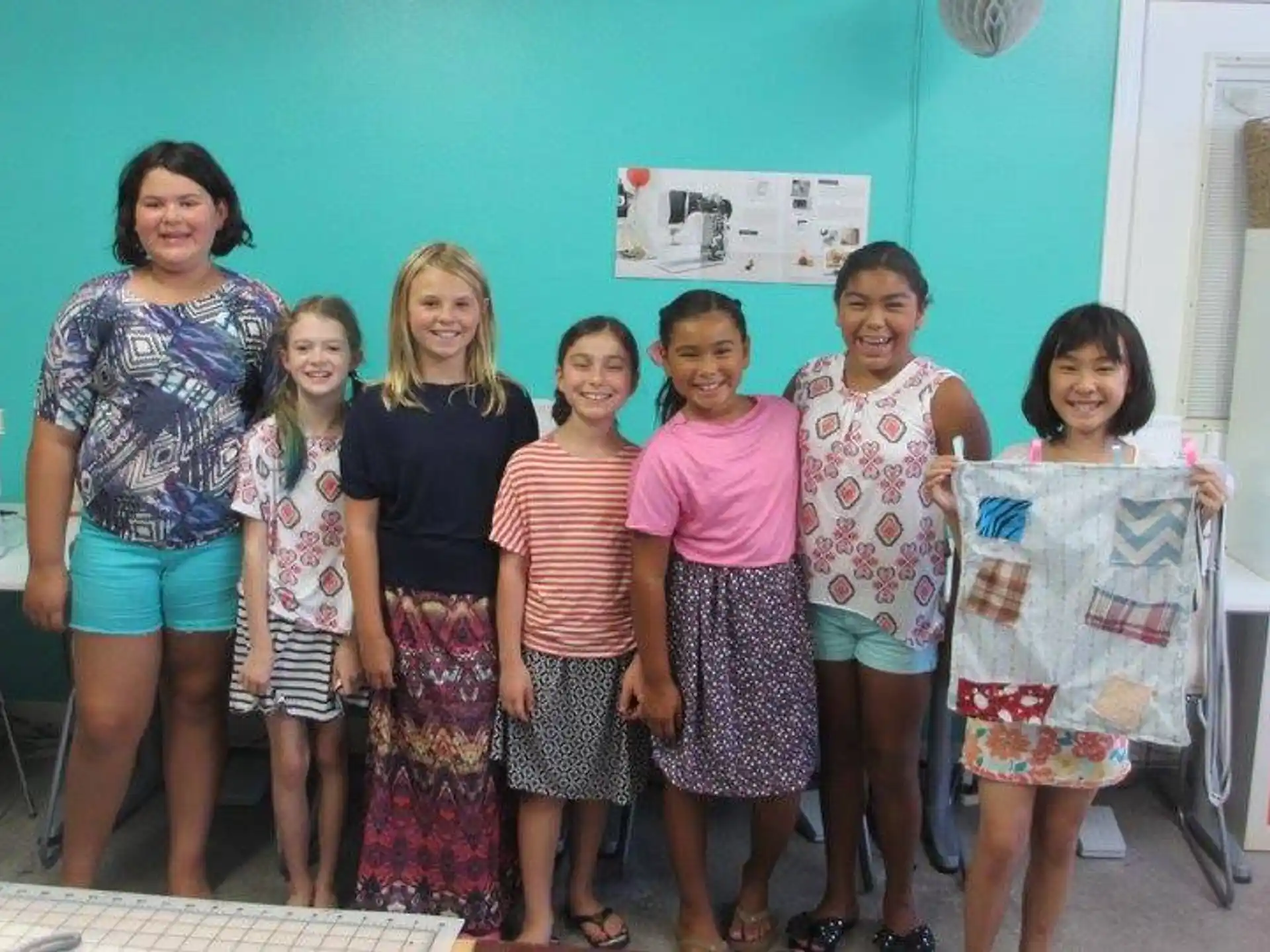 a group of women posing for a photo