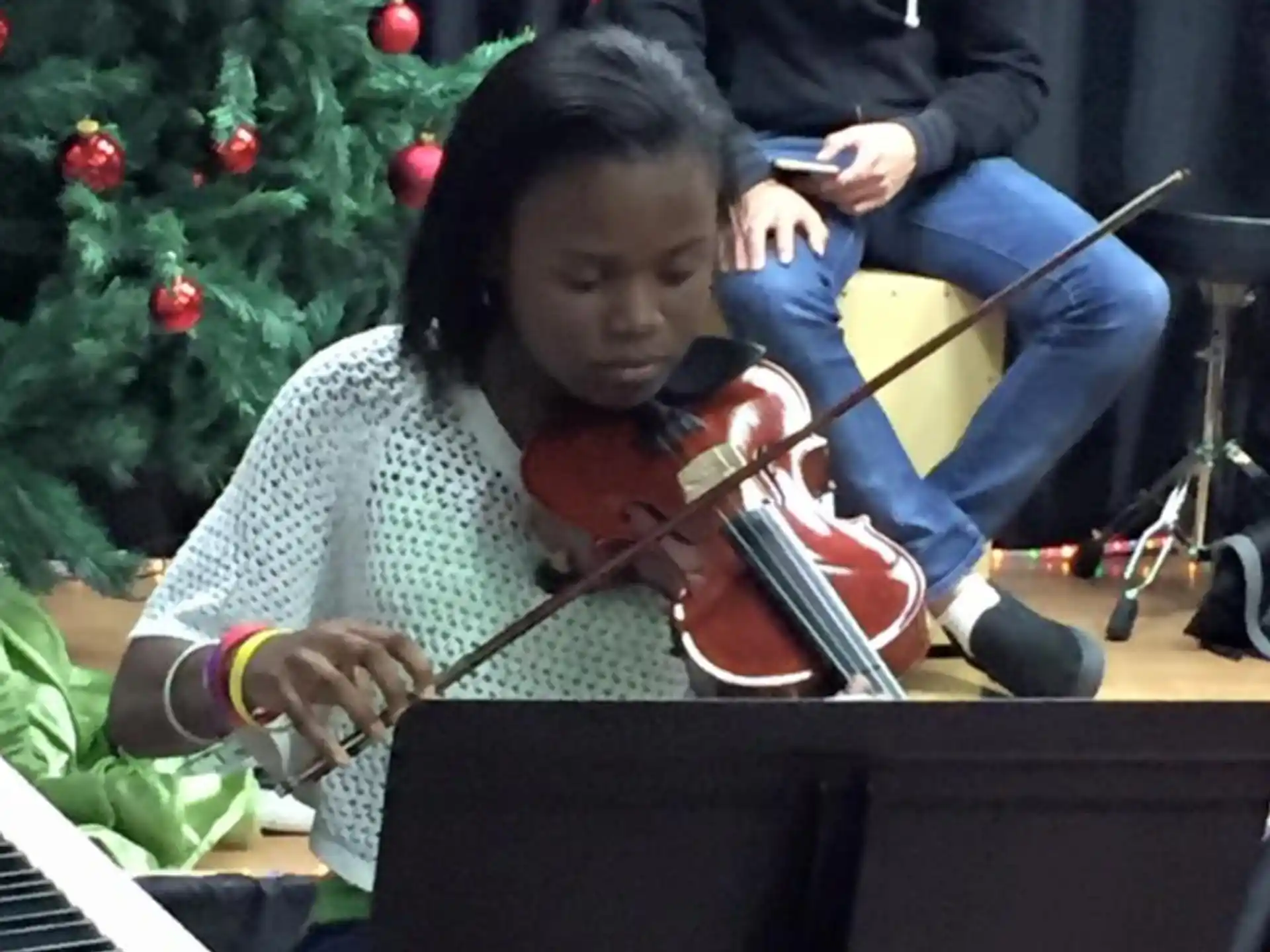 a girl playing a violin