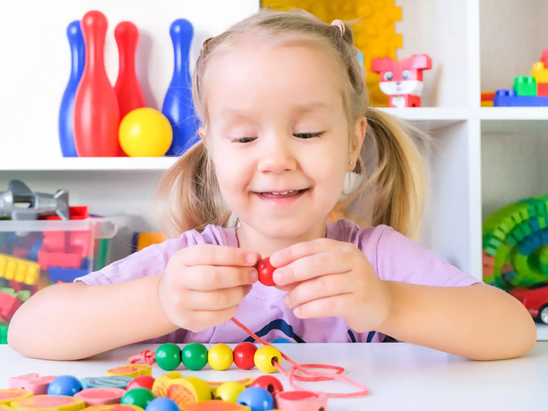 a girl playing with toys