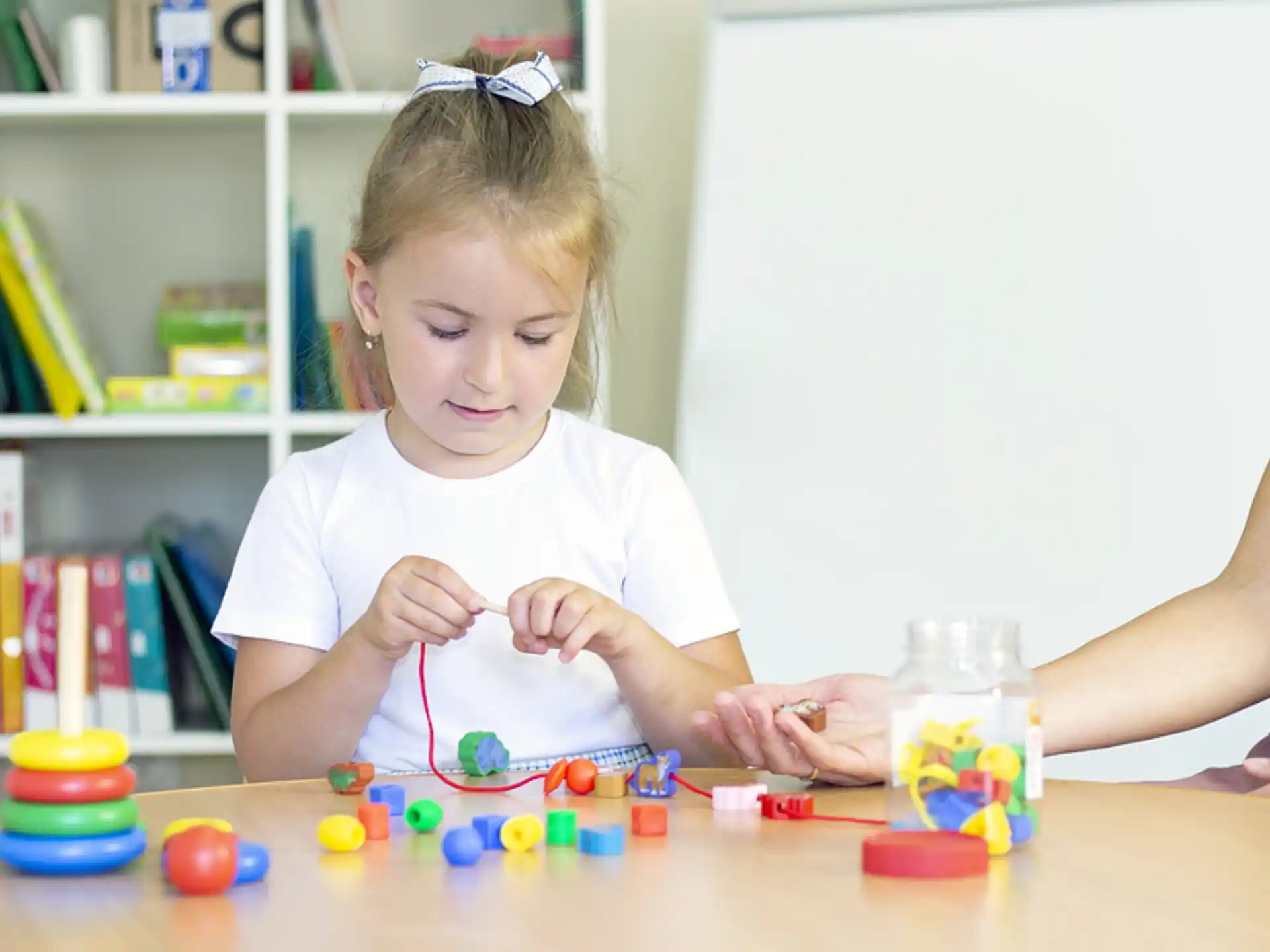 a girl playing with toys