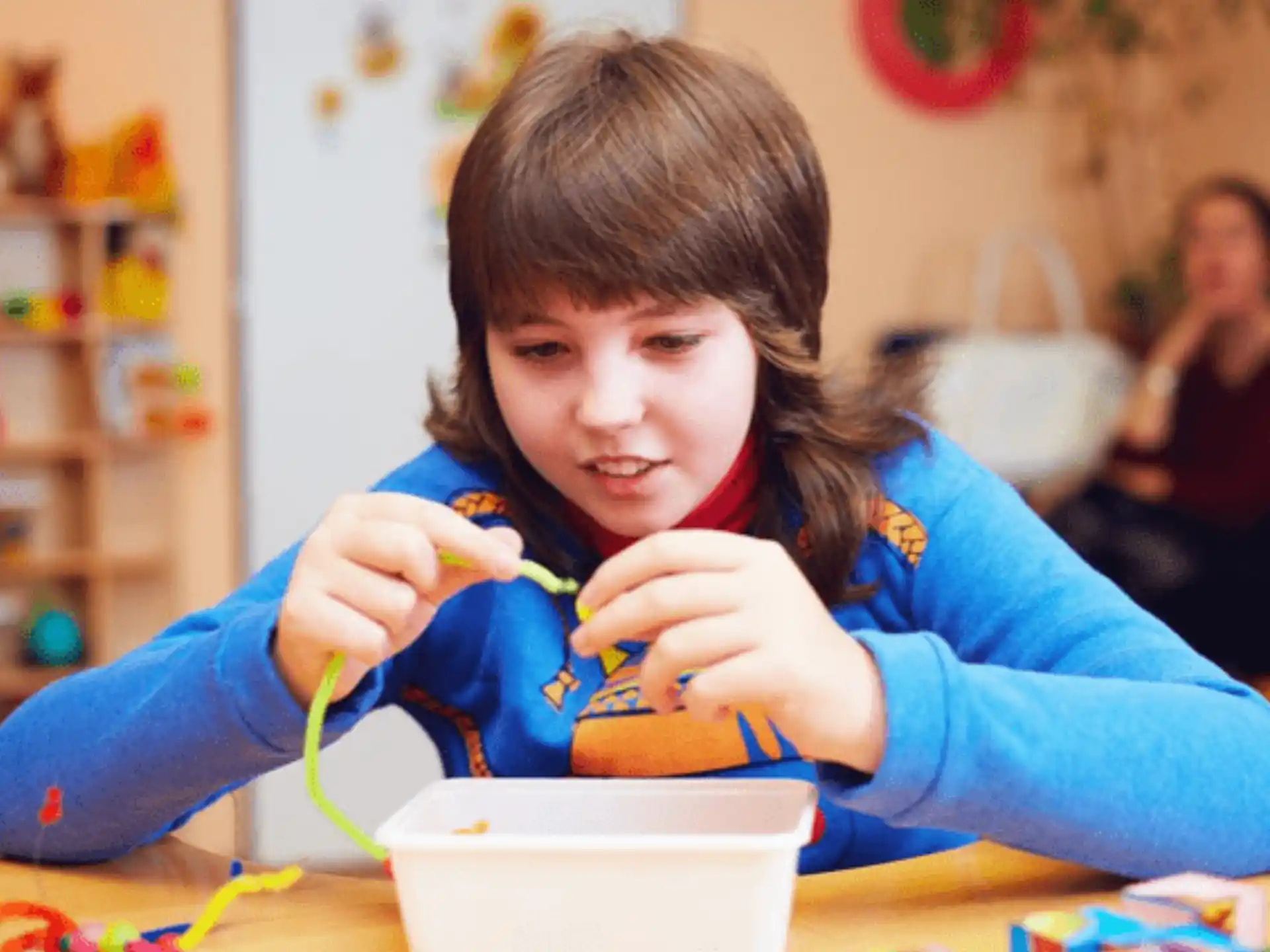 a young girl eating cereal