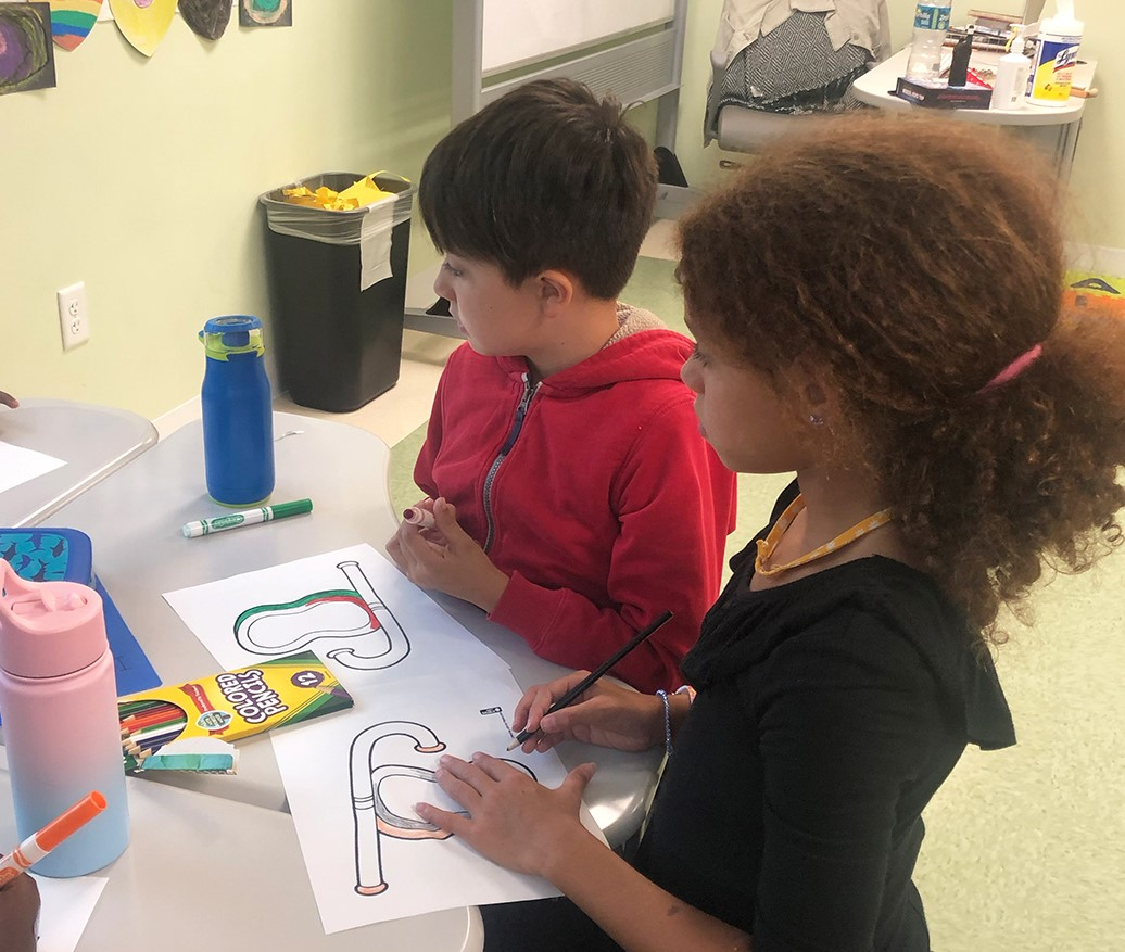 a person and a child working on a project