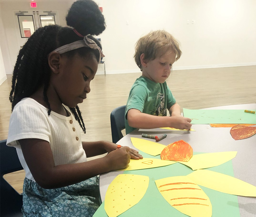 a woman and a child painting
