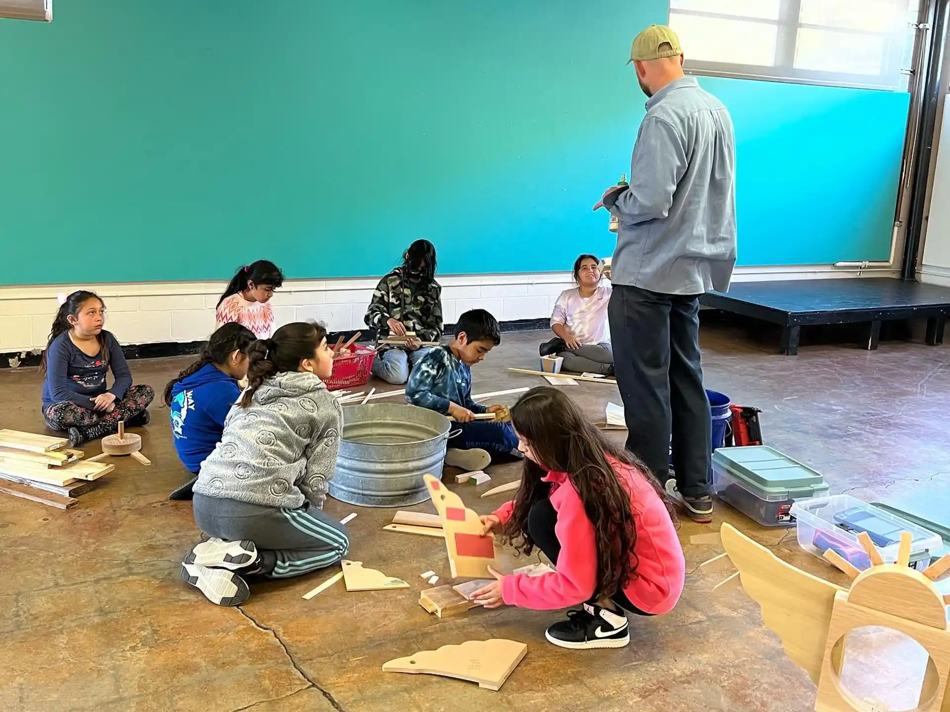 a person teaching a group of children
