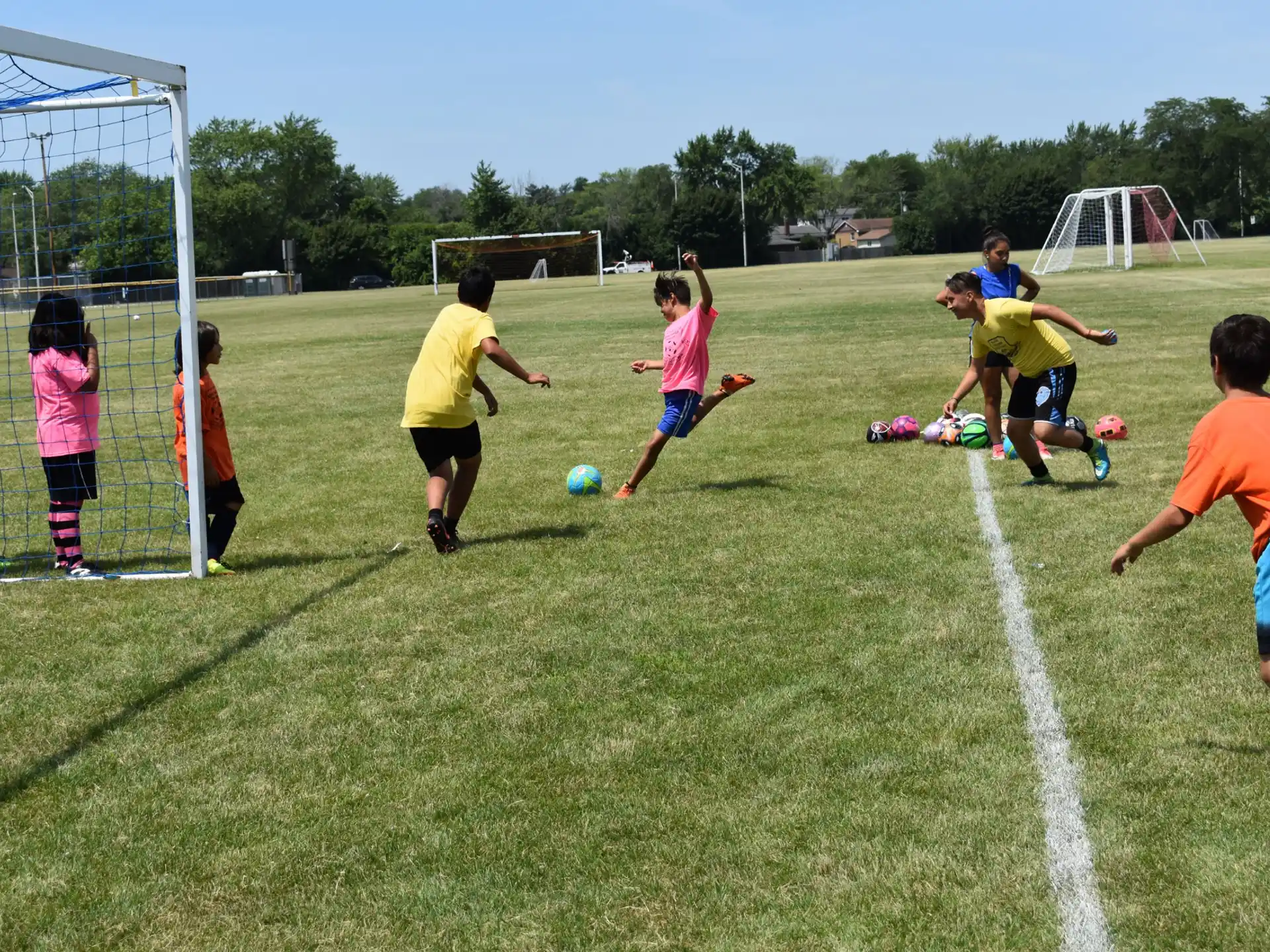kids playing football on a field