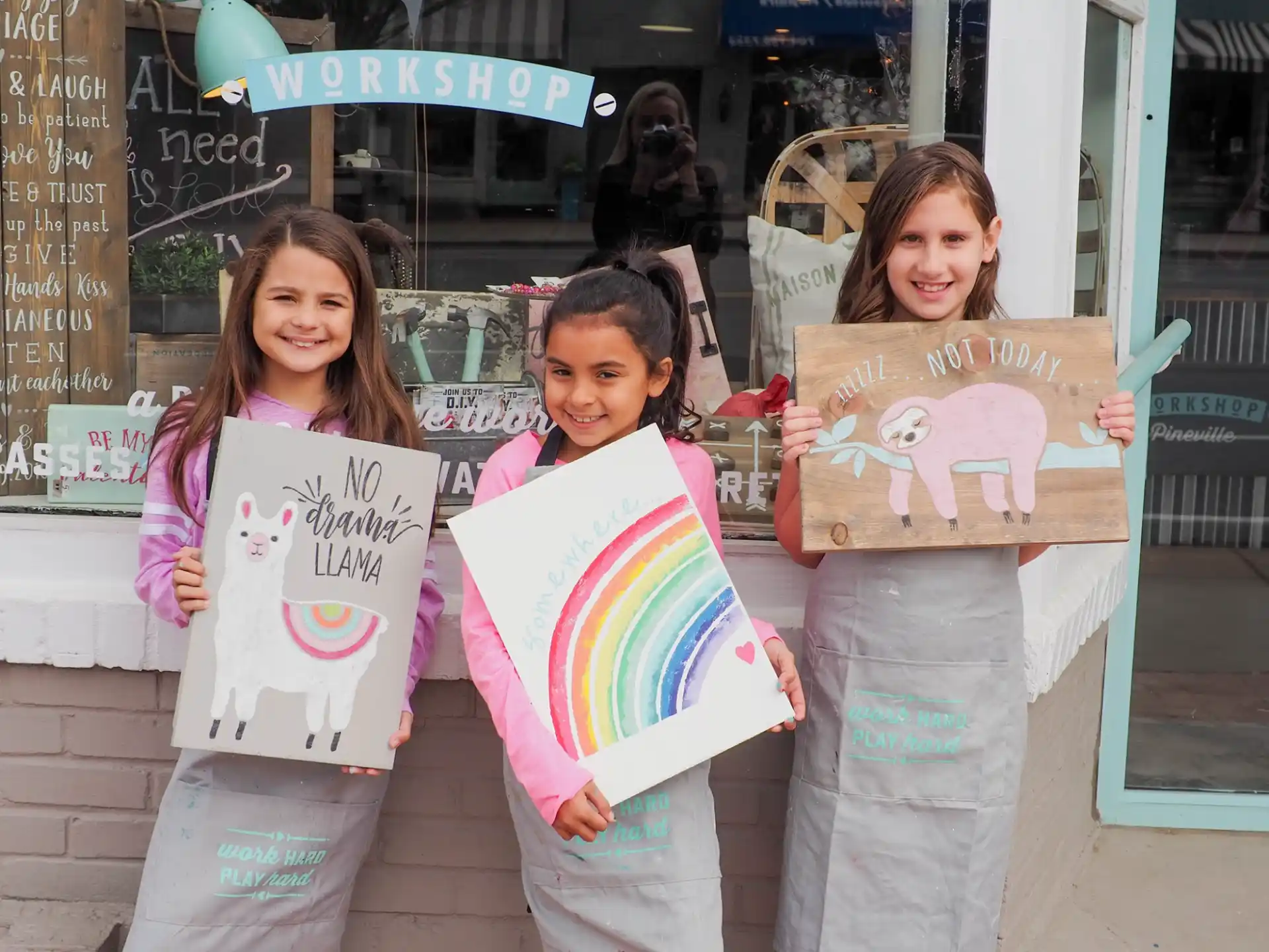 a group of girls holding signs