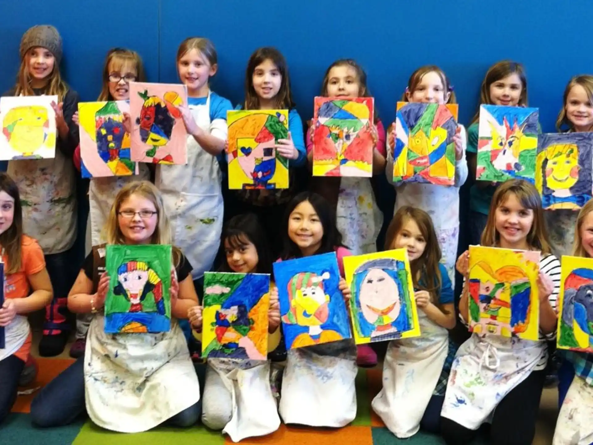 a group of children holding books