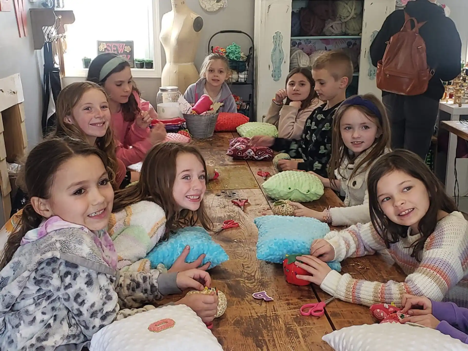 a group of children sitting at a table