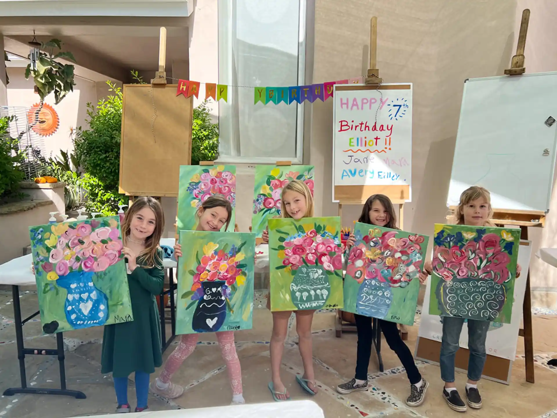 a group of children holding flowers