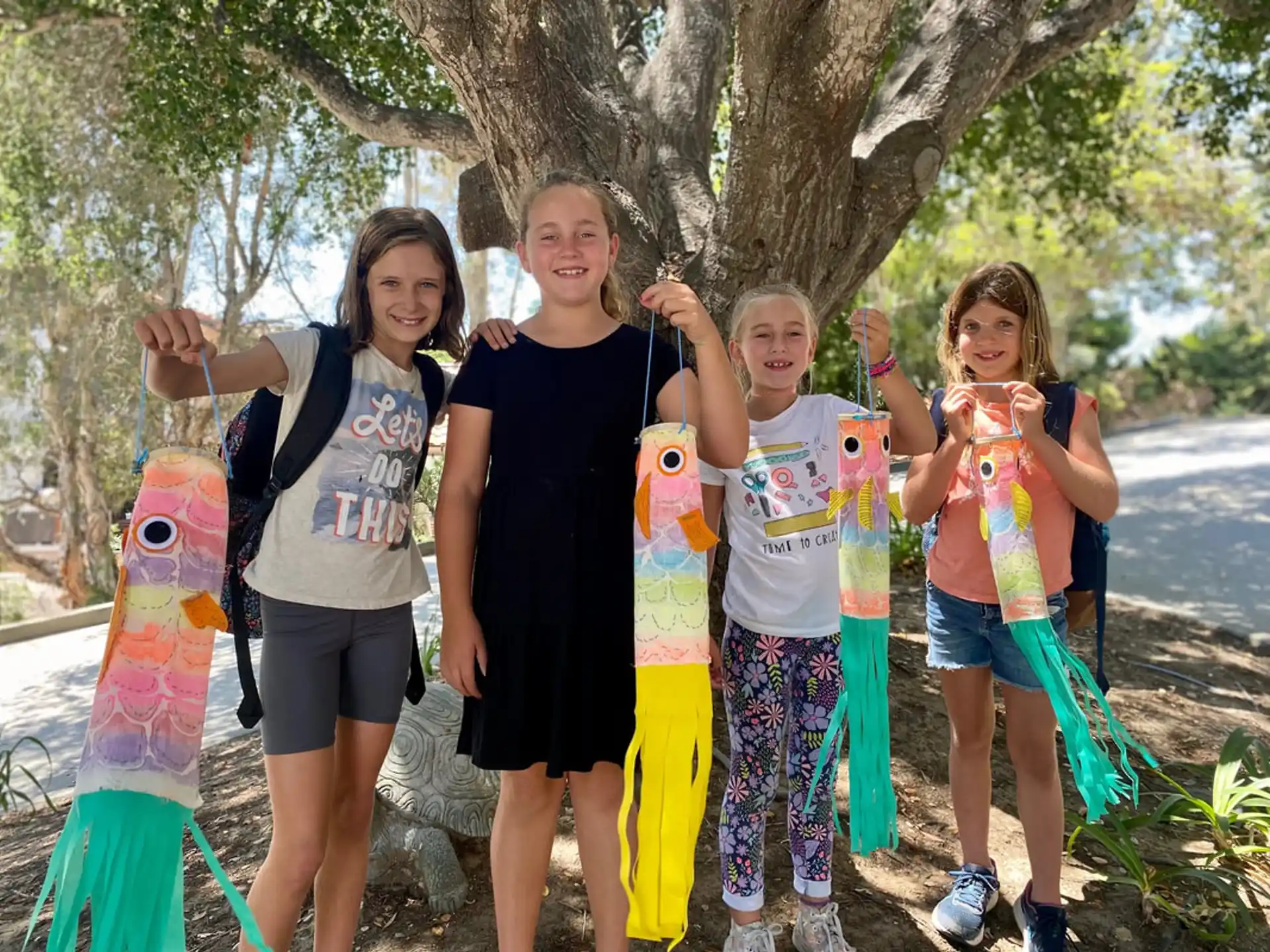 a group of kids holding up toys
