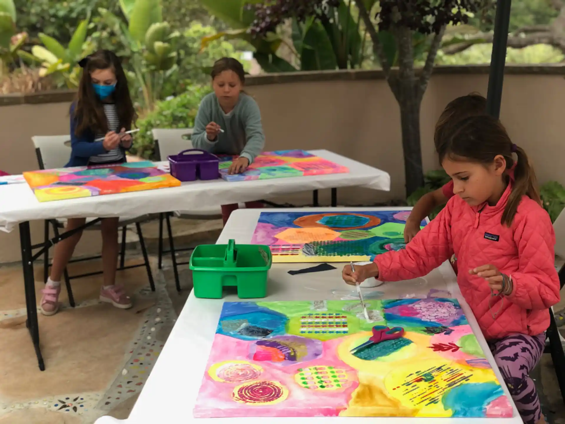 children painting on a table