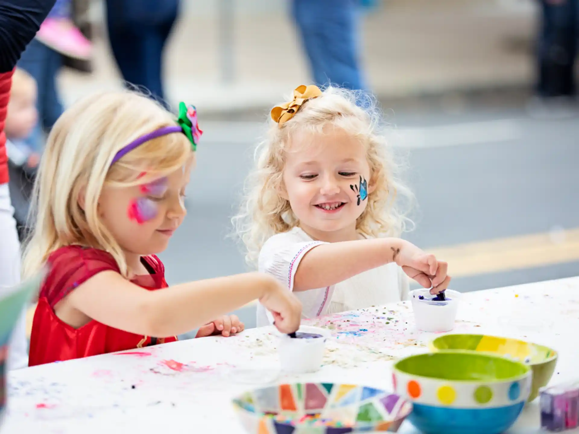 a couple of young girls painting