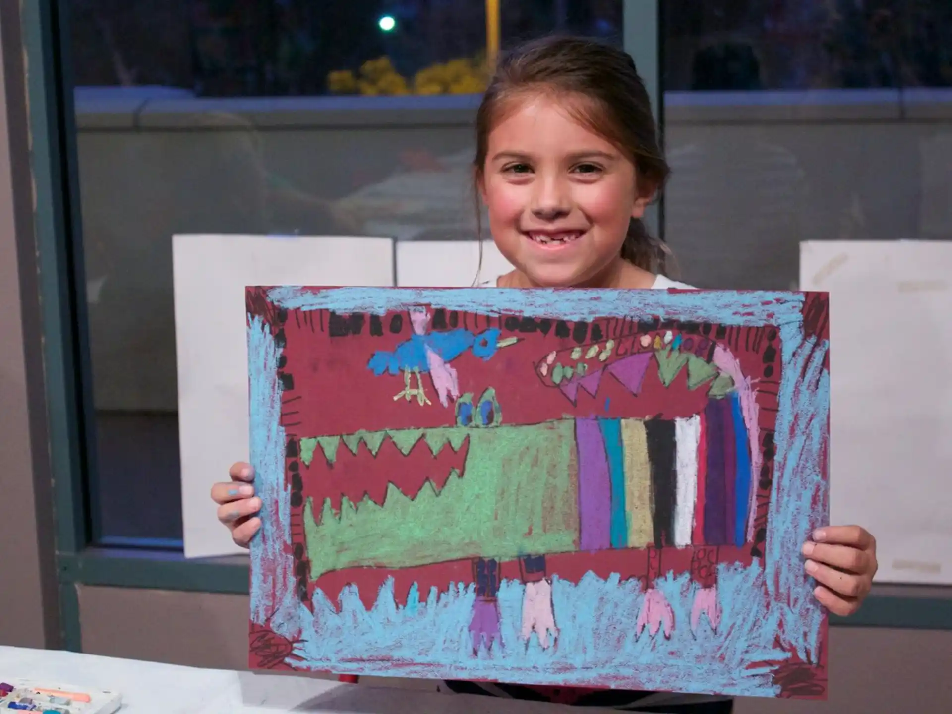 a girl holding a box